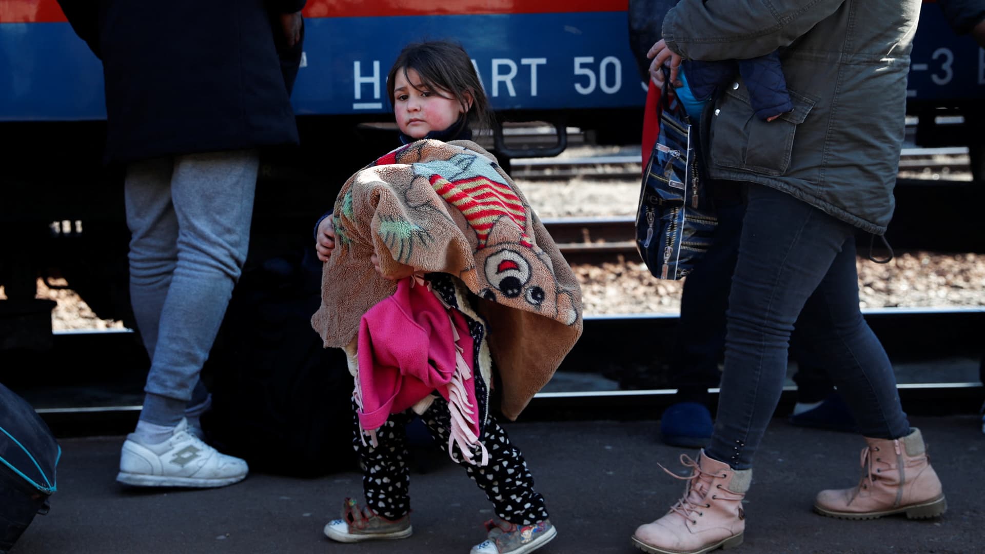 People fleeing from Ukraine to Hungary arrive at the train station, after Russia launched a massive military operation against Ukraine, in Zahony, Hungary, February 27, 2022.