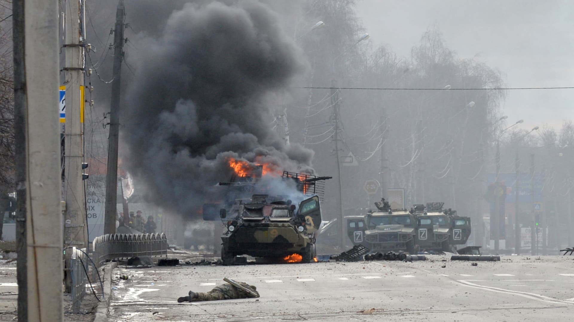 This photograph taken on February 26, 2022 shows a Russian Armoured personnel carrierburning during fight with the Ukrainian armed forces in Kharkiv.