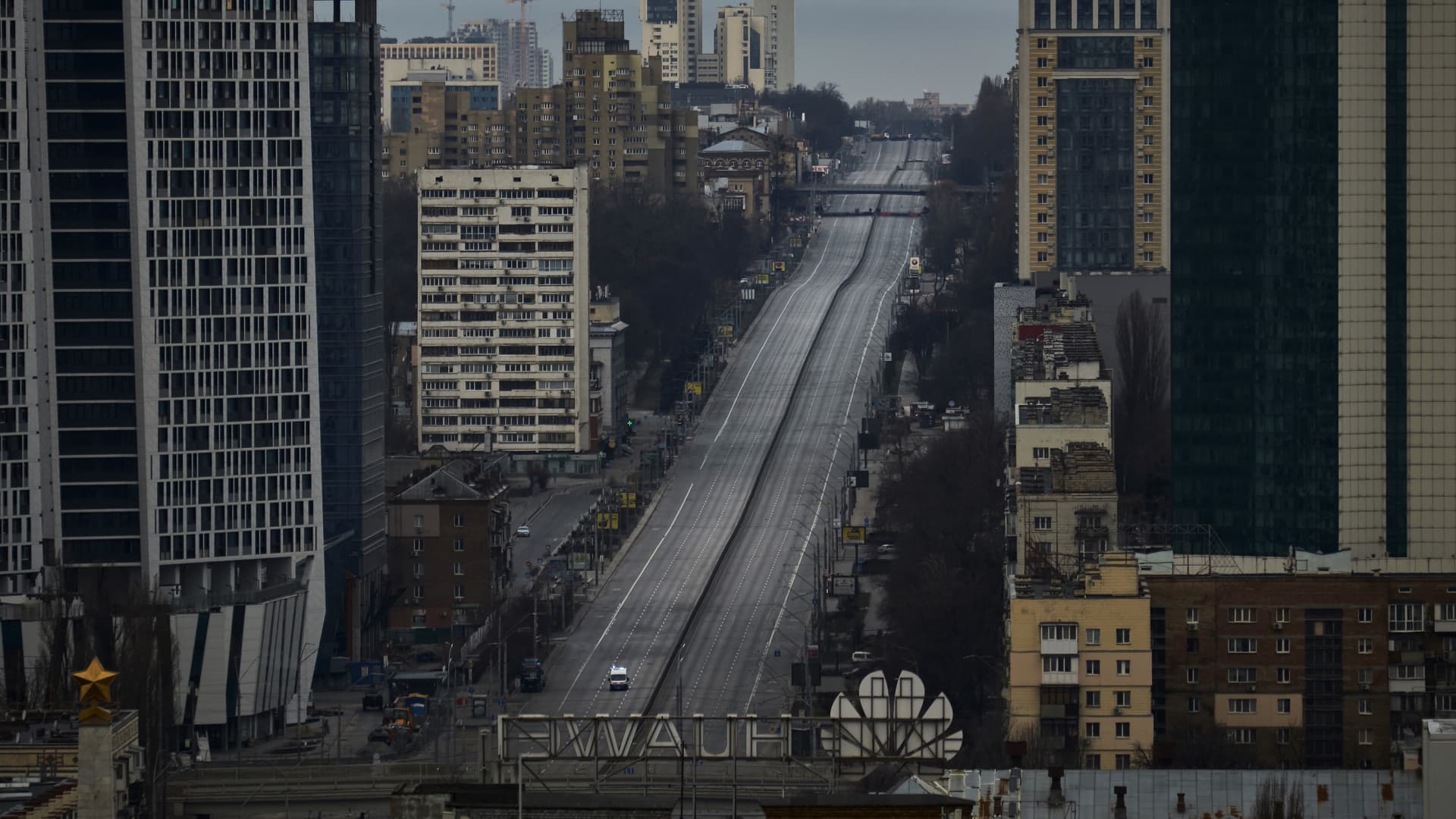 An ambulance drives along an empty street during a curfew imposed from Saturday 5pm to Monday 8am local time on February 27, 2022 in Kyiv, Ukraine.