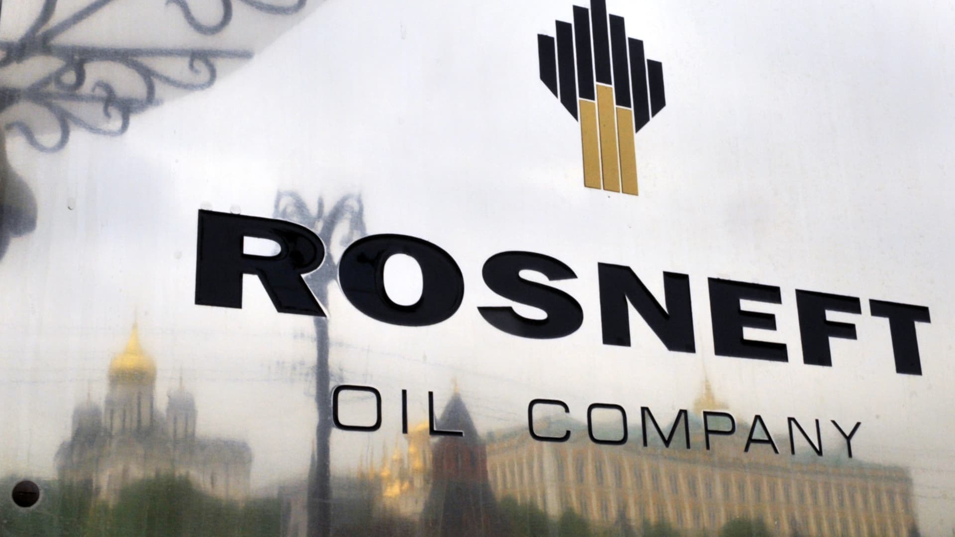 The Kremlin is reflected in the polished company plate of the state-controlled Russian oil giant Rosneft at the entrance of the headquarters in Moscow,