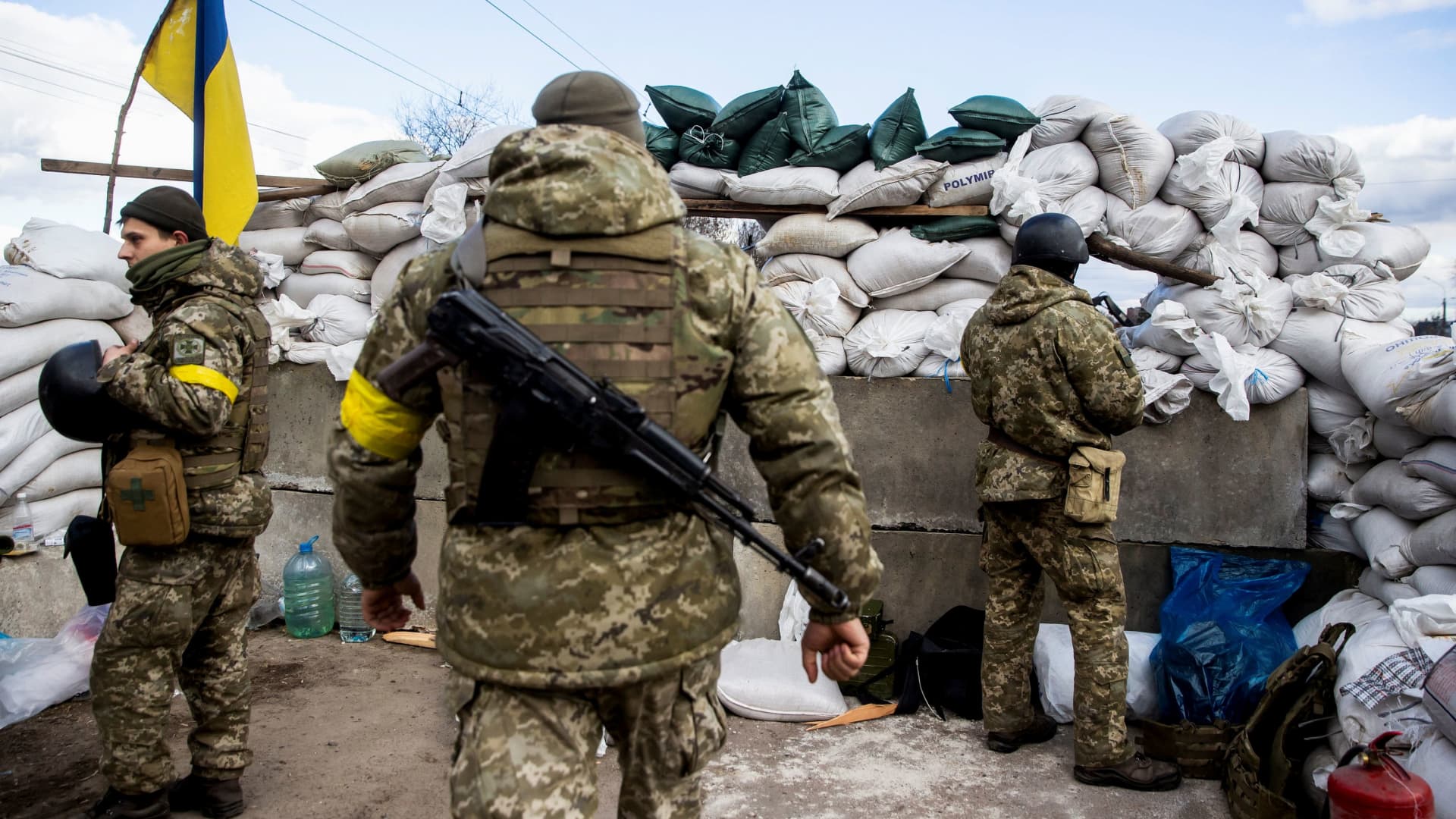 Ukrainian service members are seen, after Russia launched a massive military operation against Ukraine, at a check point in the city of Zhytomyr, Ukraine February 27, 2022.