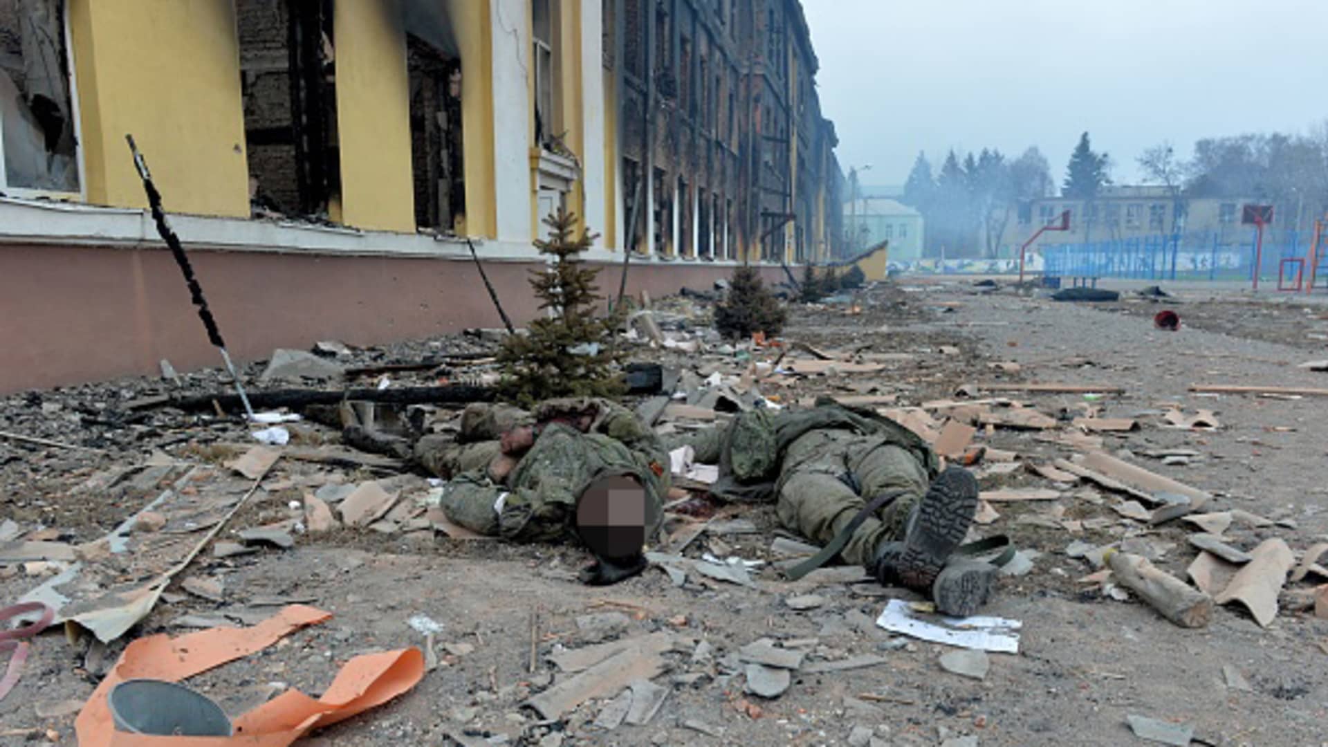 Bodies of Russian soldiers lay outside a school destroyed as a result of fight not far from the center of Ukrainian city of Kharkiv, located some 50 km from Ukrainian-Russian border, on February 28, 2022.