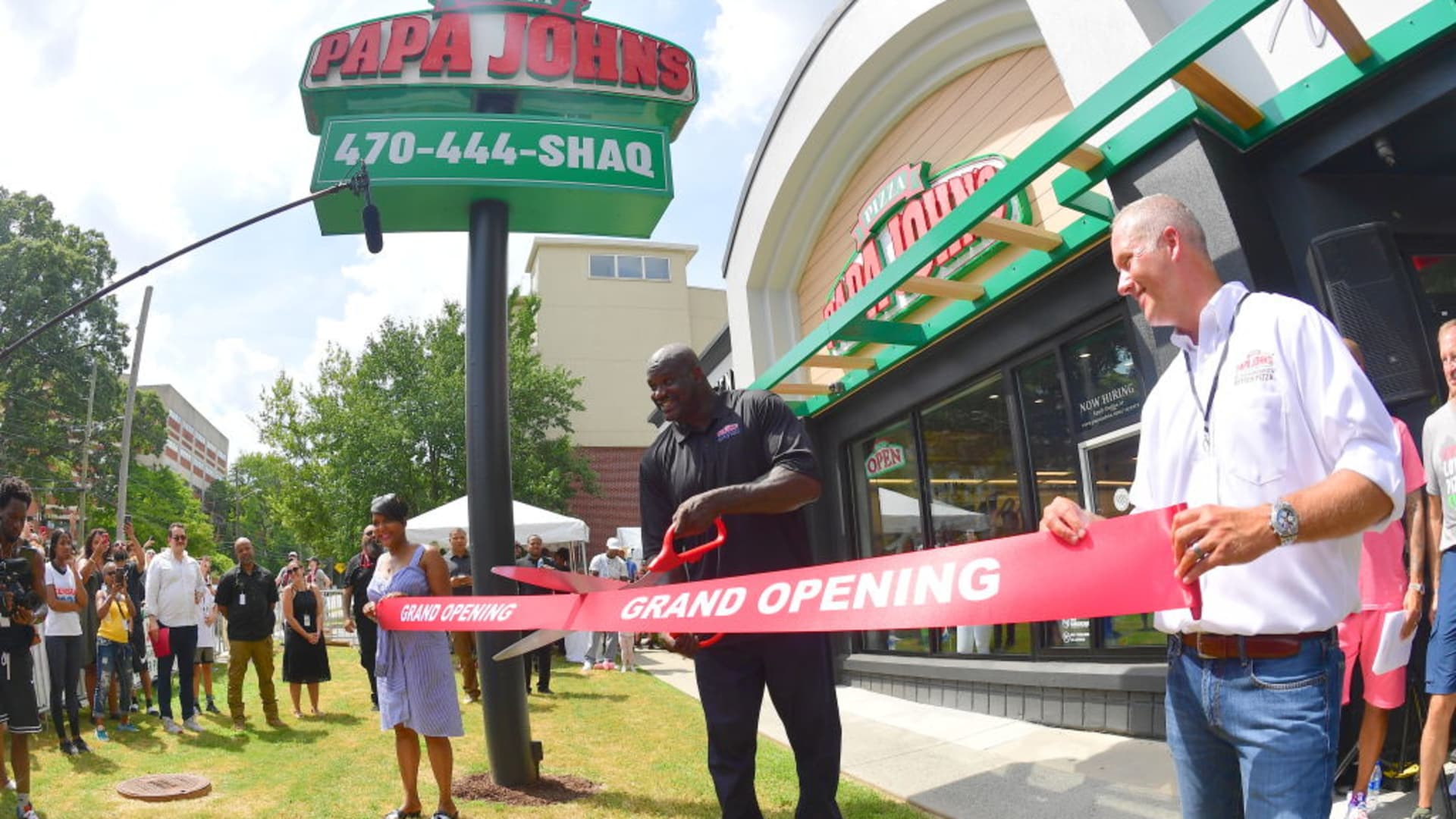 Keisha Lance Bottoms, Steve Ritchie and Shaquille O'Neal attend Shaq's Papa John's Pizza Grand Opening on August 24, 2019 in Atlanta, Georgia.