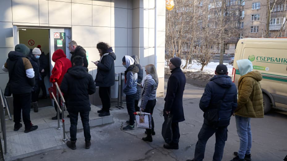 People queue at a Sberbank branch in Moscow. On 24 February, the United States announced it was imposing sanctions on major Russian banks, including Sberbank and VTB in response to the special military operation in Ukraine.