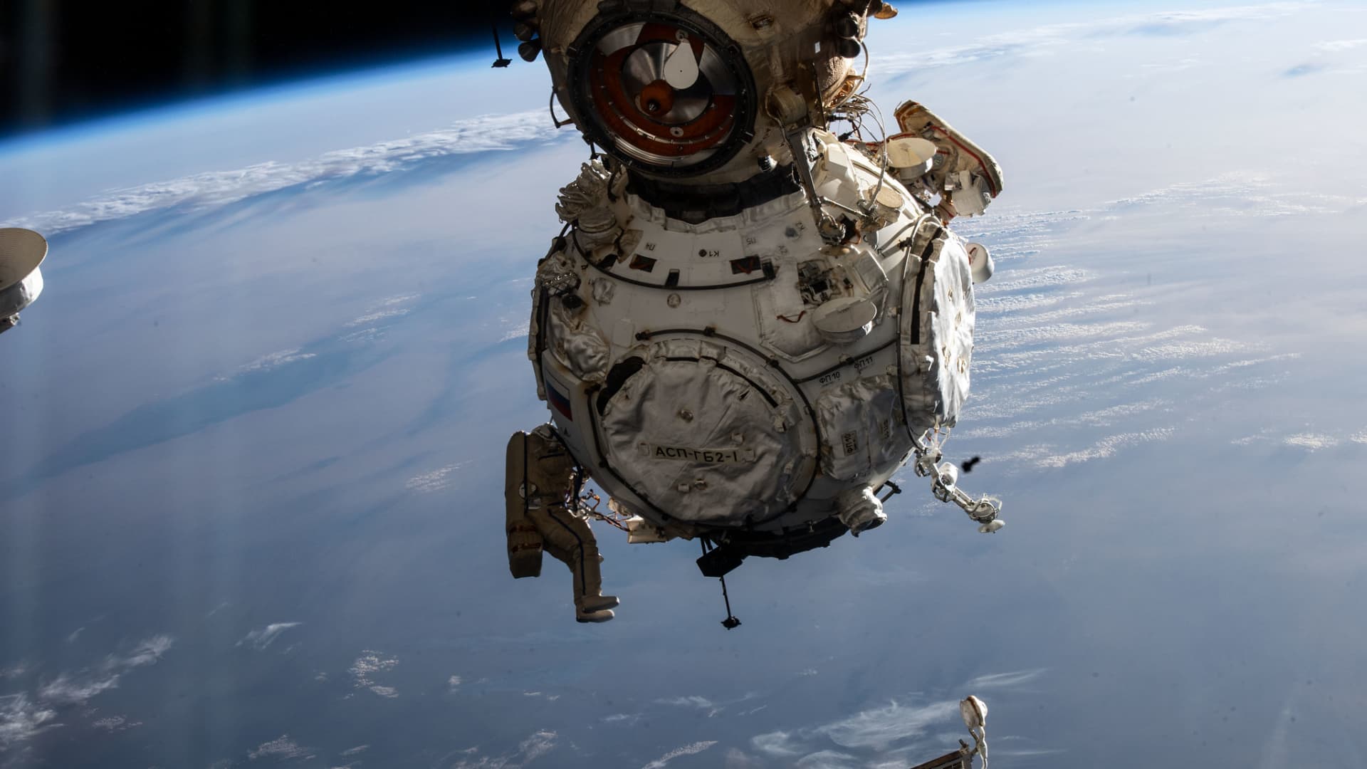 Russian cosmonauts Pyotr Dubrov and Anton Shkaplerov attach a new module to the country's segment of the International Space Station during a spacewalk on Jan. 19, 2022.