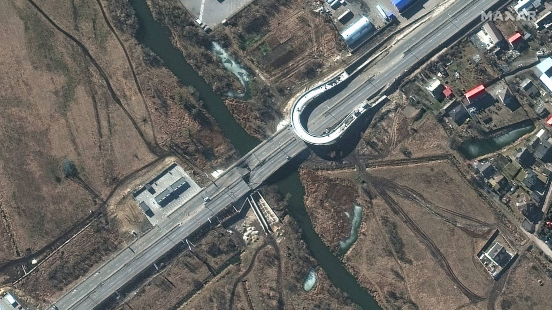Maxar closeup satellite imagery of destroyed vehicles and bridge damage in Irpin, Ukraine - Northwest of Kyiv.