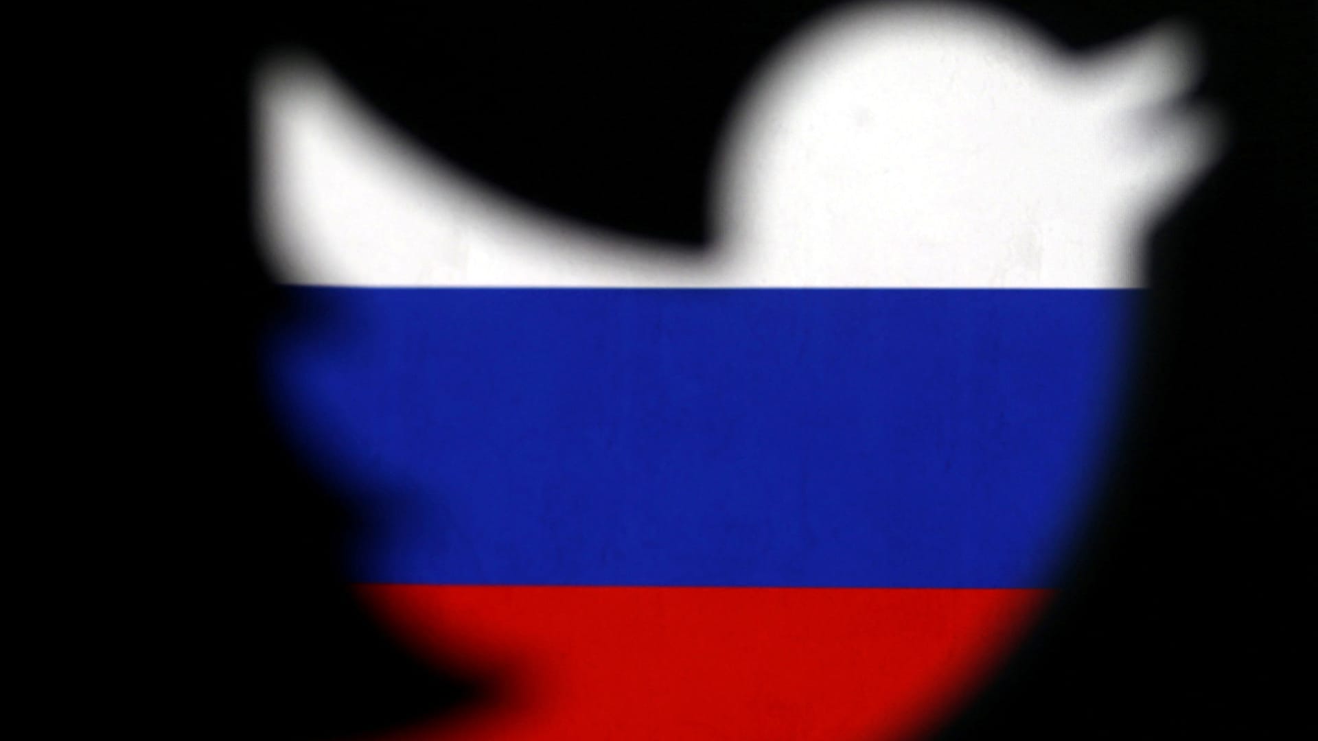A 3D-printed Twitter logo displayed in front of Russian flag is seen in this illustration picture, October 27, 2017.