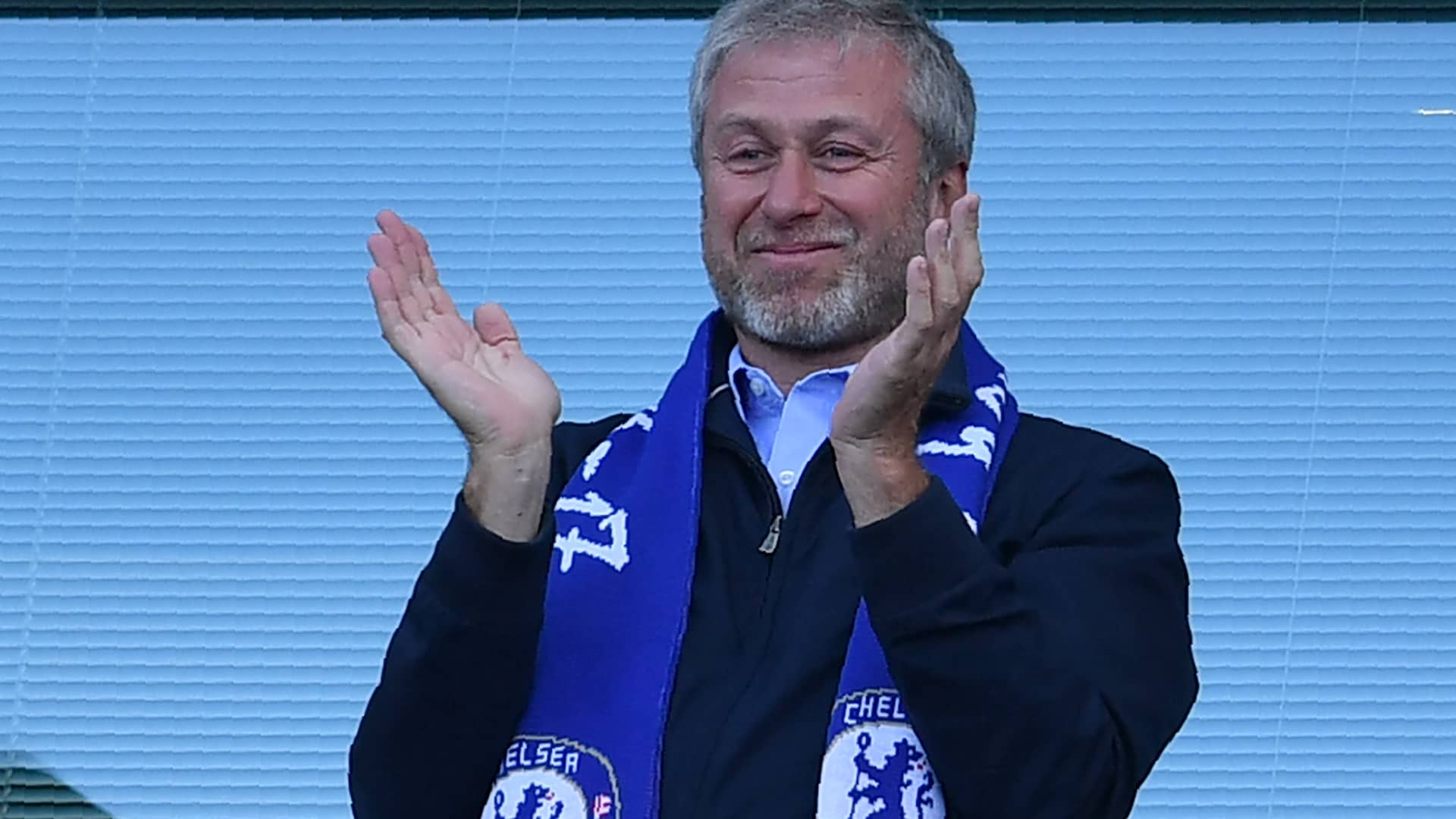 Chelsea's Russian owner Roman Abramovich applauds as players celebrate their league title win at the end of the Premier League football match between Chelsea and Sunderland at Stamford Bridge in London on May 21, 2017.