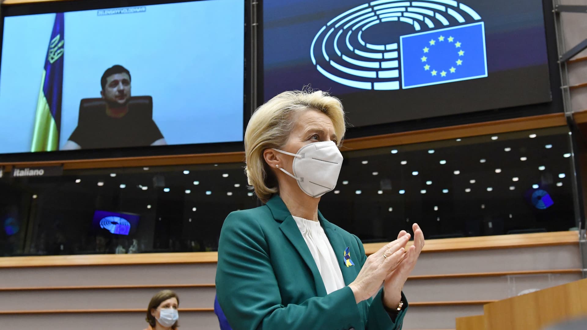 European Commission President Ursula von der Leyen applauds Ukrainian President Volodymyr Zelenskyy, who speaks in a video conference during a special plenary session of the European Parliament at the EU headquarters in Brussels on March 1, 2022.