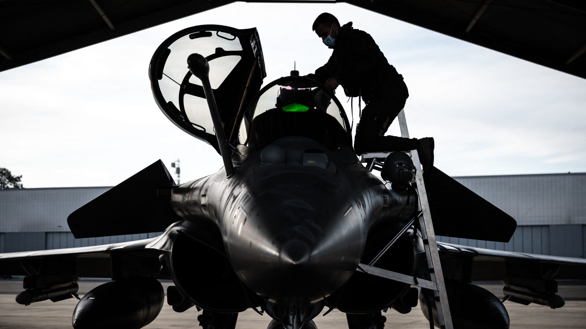 A Rafale fighter jet pilot inspects his aircraft prior to taking off for a daily NATO border watch mission sortie over Poland at the Mont-de-Marsan airbase, southwestern France, on March 1, 2022.