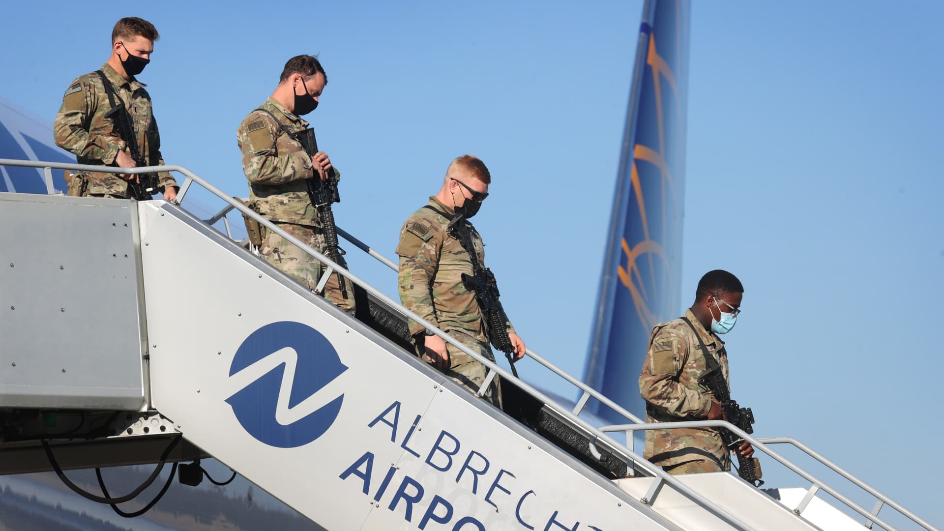 U.S. soldiers leave a Boeing 767-300 that has just landed at Albrecht Dürer Airport.