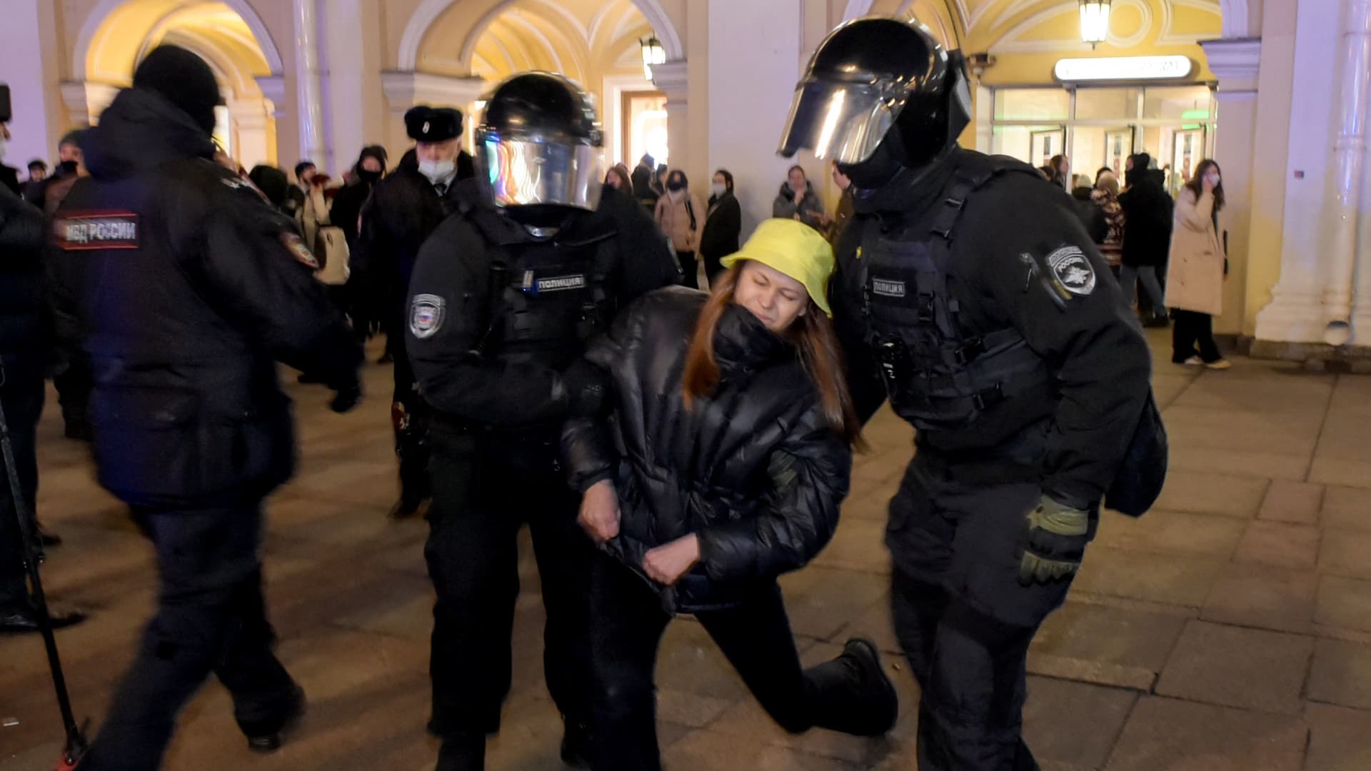 Police officers detain a demonstrator during a protest against Russia's invasion of Ukraine in central Saint Petersburg on March 1, 2022.