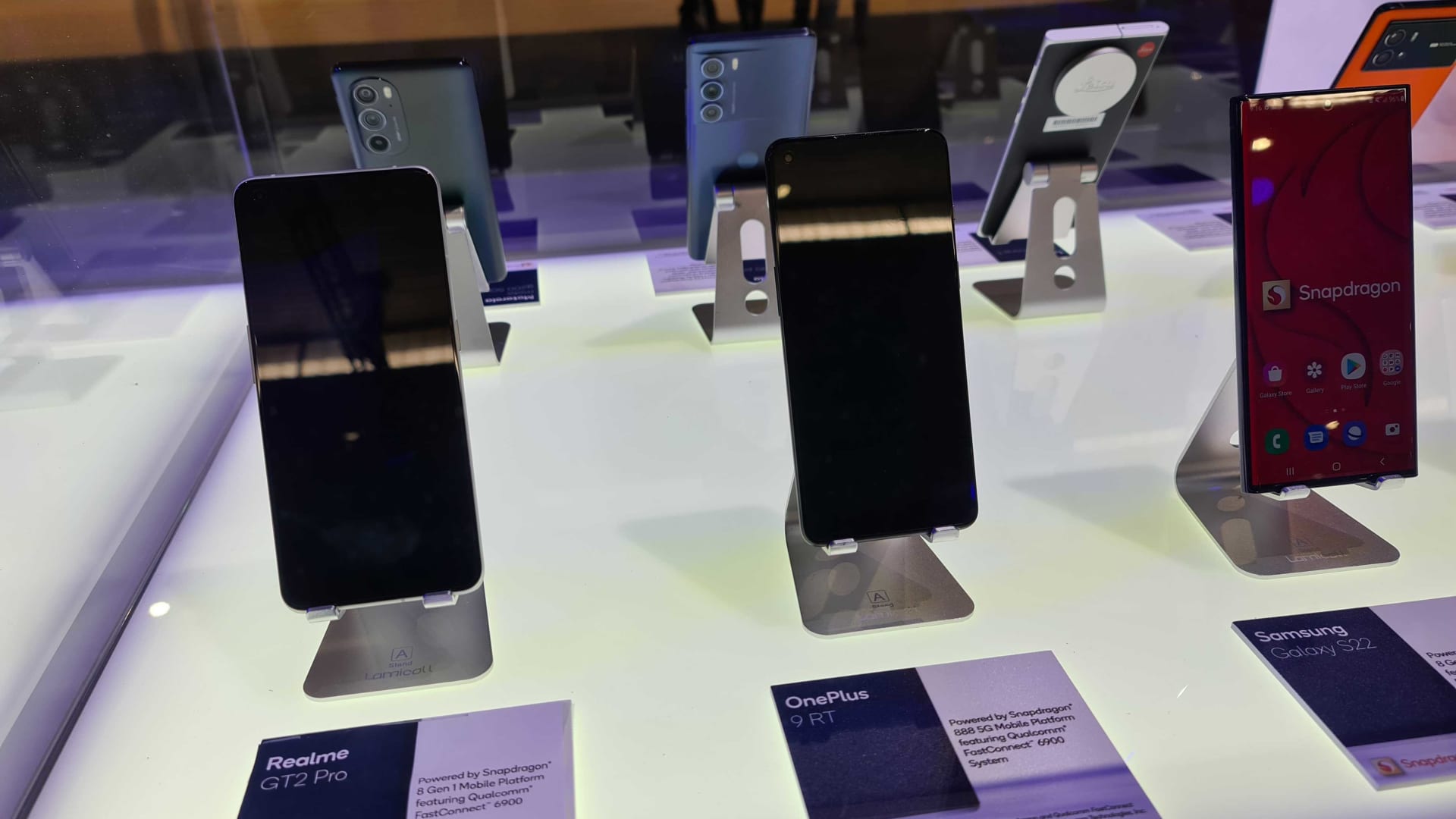 Smartphones on display at Qualcomm's MWC stand.