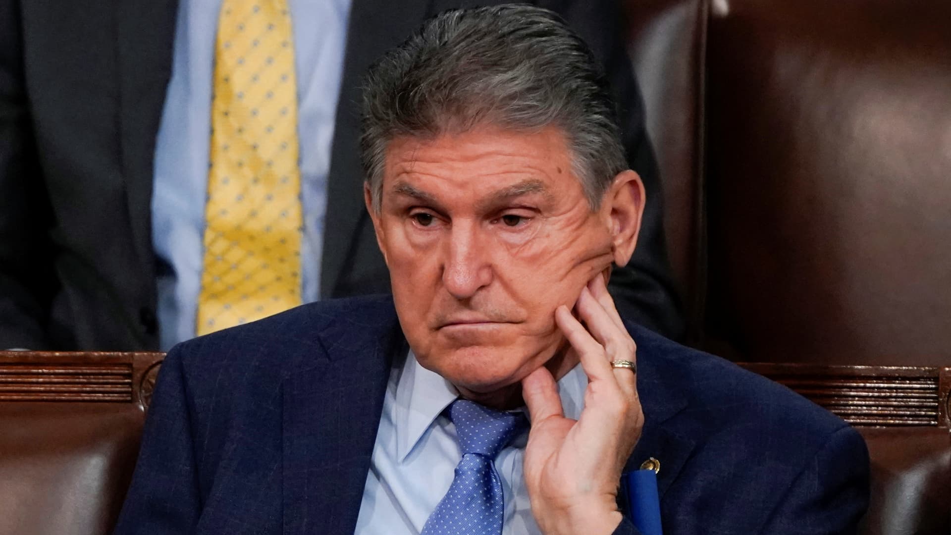 Sen. Joe Manchin (D-WV) listens as U.S. President Joe Biden delivers his first State of the Union address to a joint session of Congress, in the U.S. Capitol in Washington, DC, U.S., March 1. 2022.