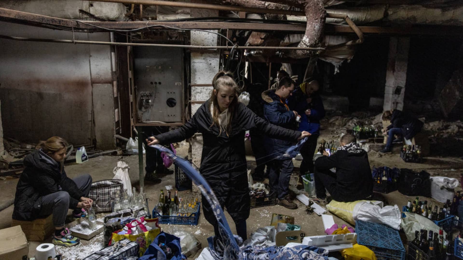 Volunteers make molotov cocktails in the basement of a bomb shelter in Kyiv, Ukraine.