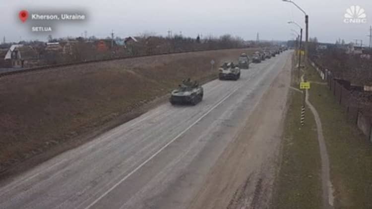 Russian forces surround two key cities in southern Ukraine as the invasion continues