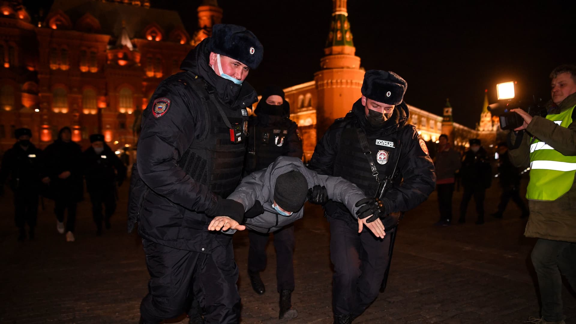 Police officers detain a man during a protest against Russia's invasion of Ukraine in central Moscow on March 2, 2022.