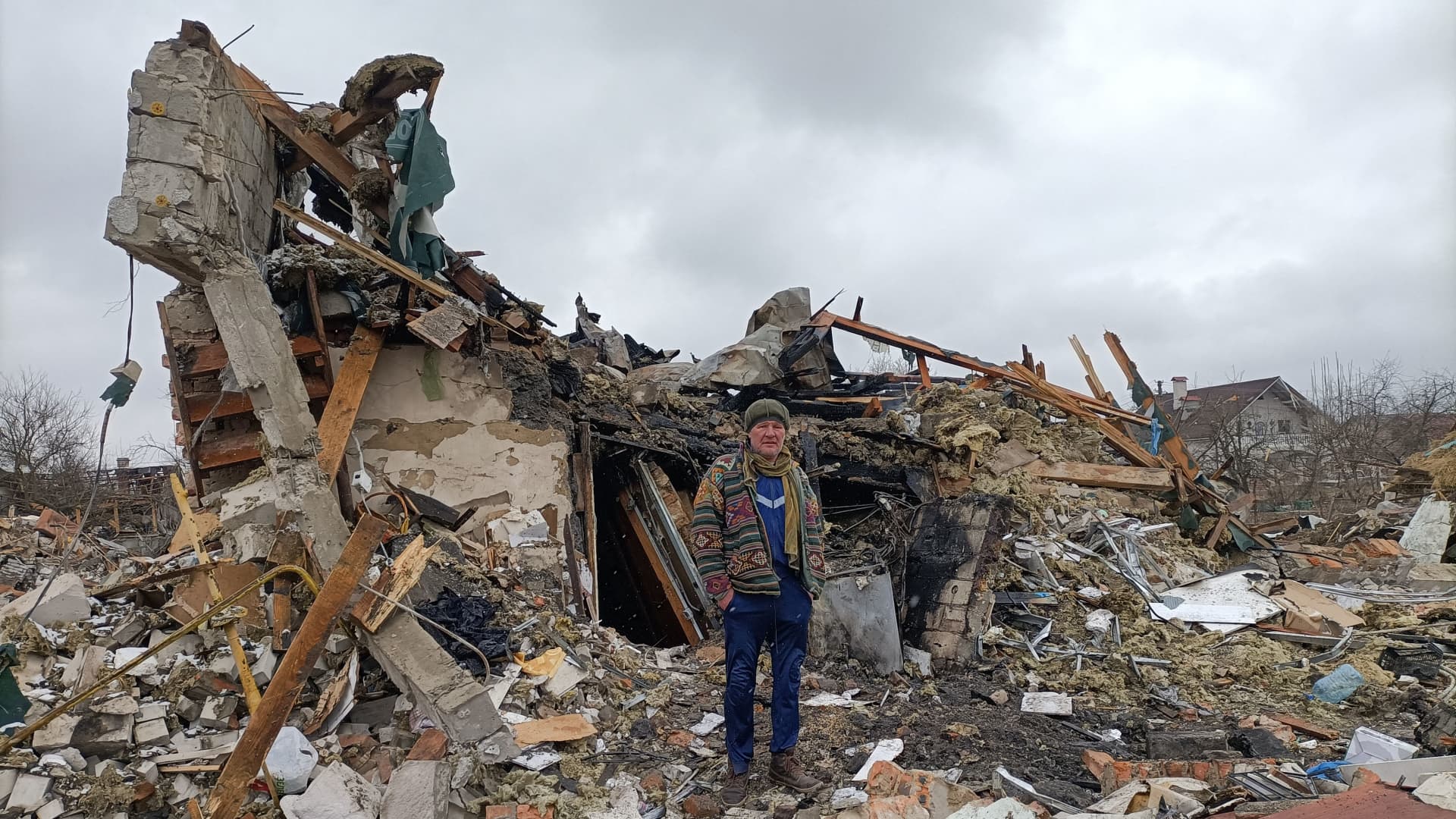 A Ukrainian man stands in the rubble in Zhytomyr on March 02, 2022, following a Russian bombing the day before.