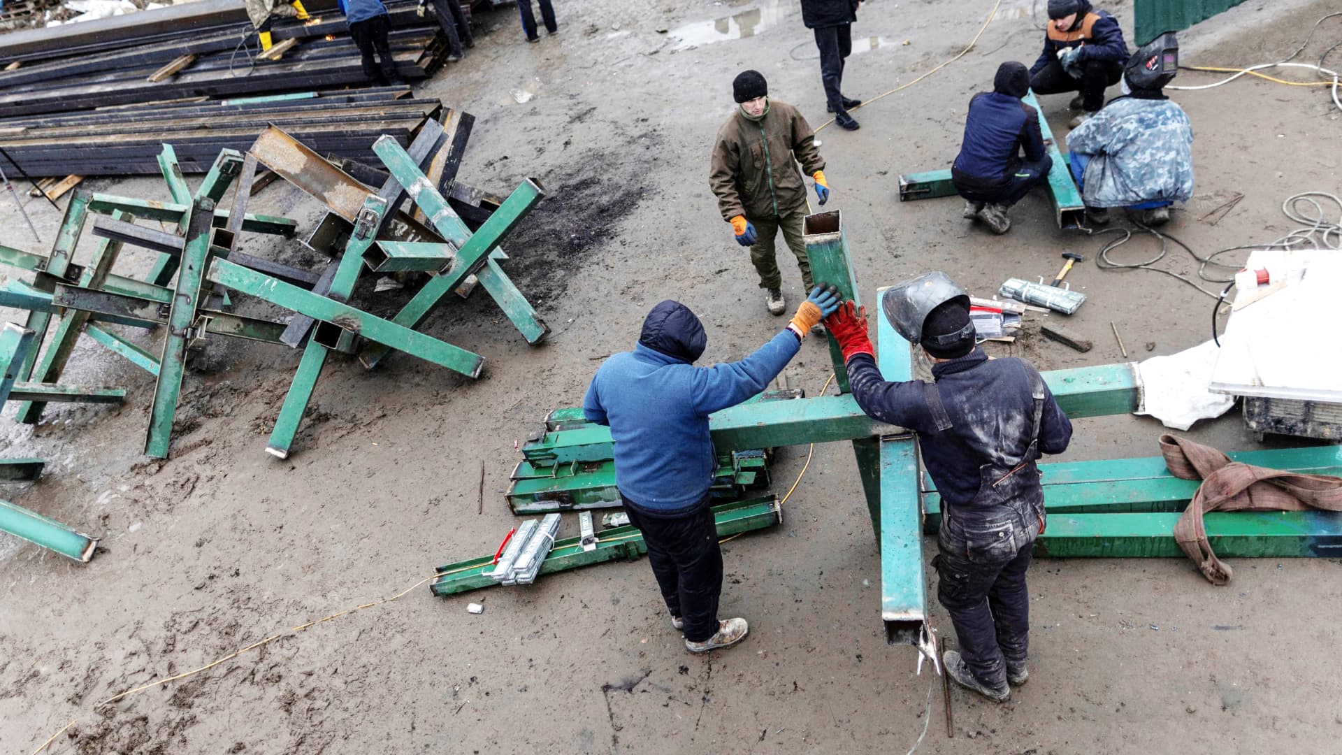 Workers from a local construction company weld anti-tanks obstacles to be place on road around Kyiv as Russia's invasion of Ukraine continues, in Kyiv, Ukraine March 3, 2022.