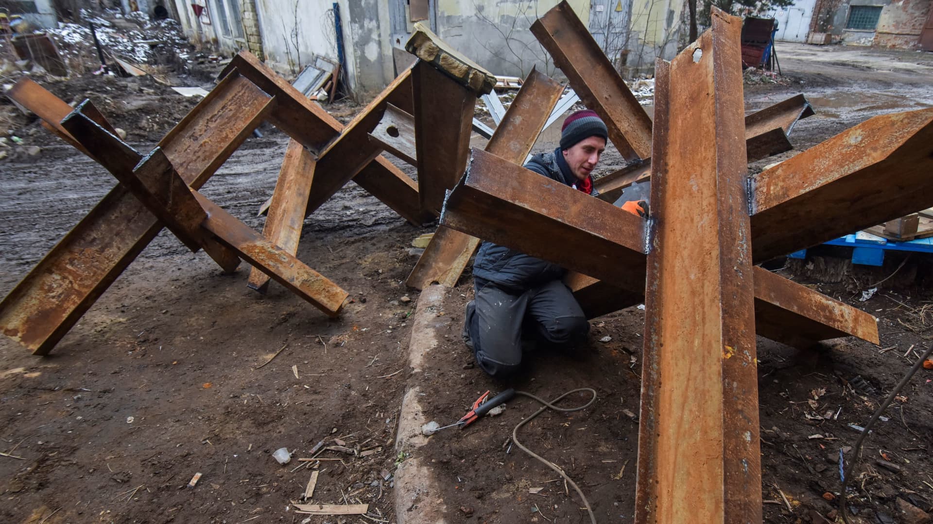 A local resident makes anti-tank obstacles to defend his and others cities, as Russia's invasion of Ukraine continues, in Lviv, Ukraine March 2, 2022. 
