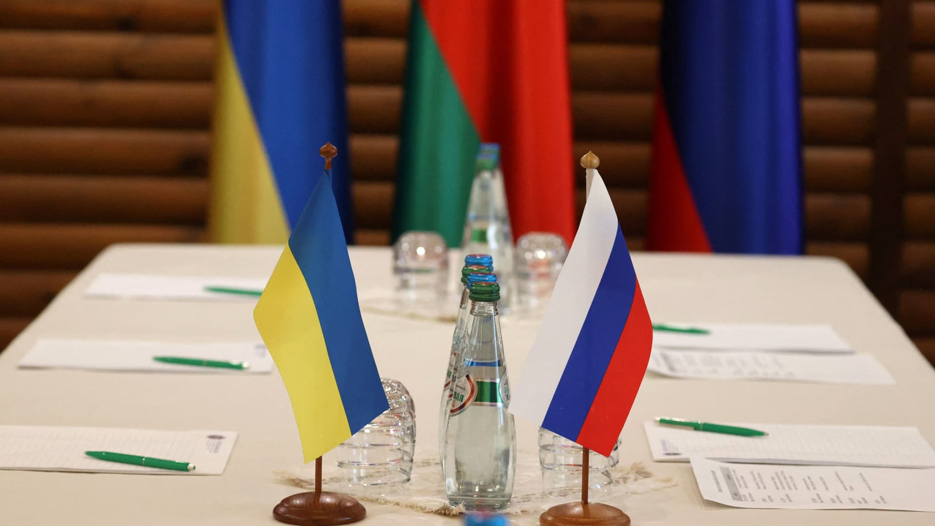 Ukrainian and Russian flags are seen on a table before talks between officials of the two countries in Belarus on March 3, 2022.