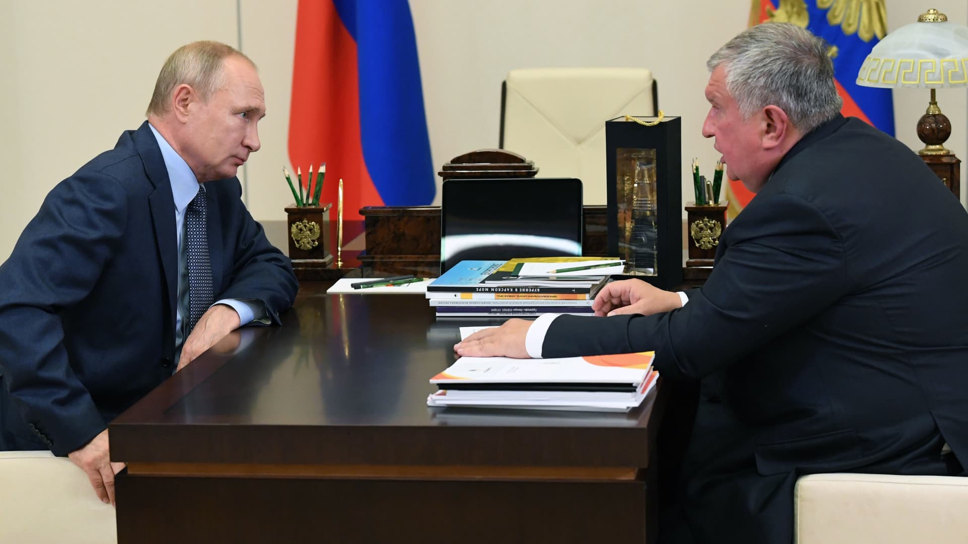 Russian President Vladimir Putin meets with Russia's oil giant Rosneft CEO Igor Sechin at the Novo-Ogaryovo state residence outside Moscow on August 18, 2020.