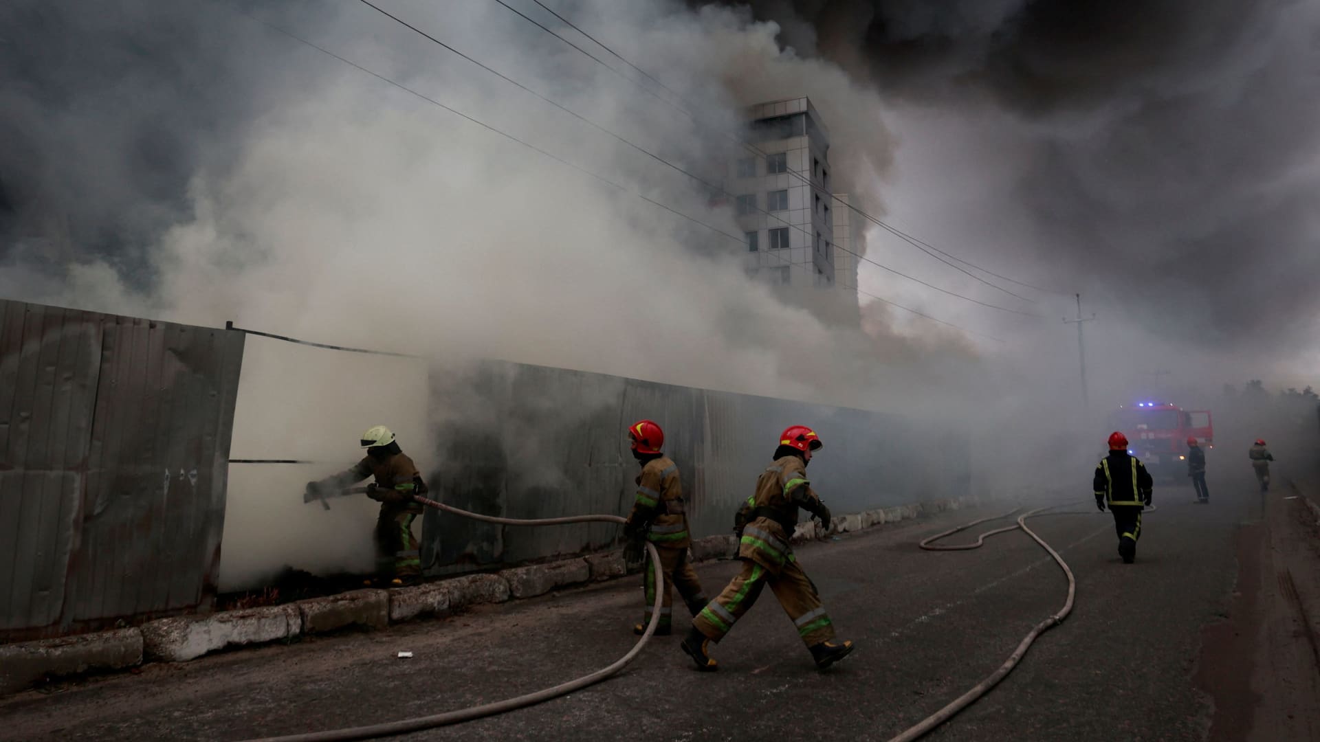 Firefighters extinguish fire at a warehouse that caught flames, according to local authorities, after shelling, as Russia's invasion of Ukraine continues, in the village of Chaiky in the Kyiv region, Ukraine March 3, 2022.