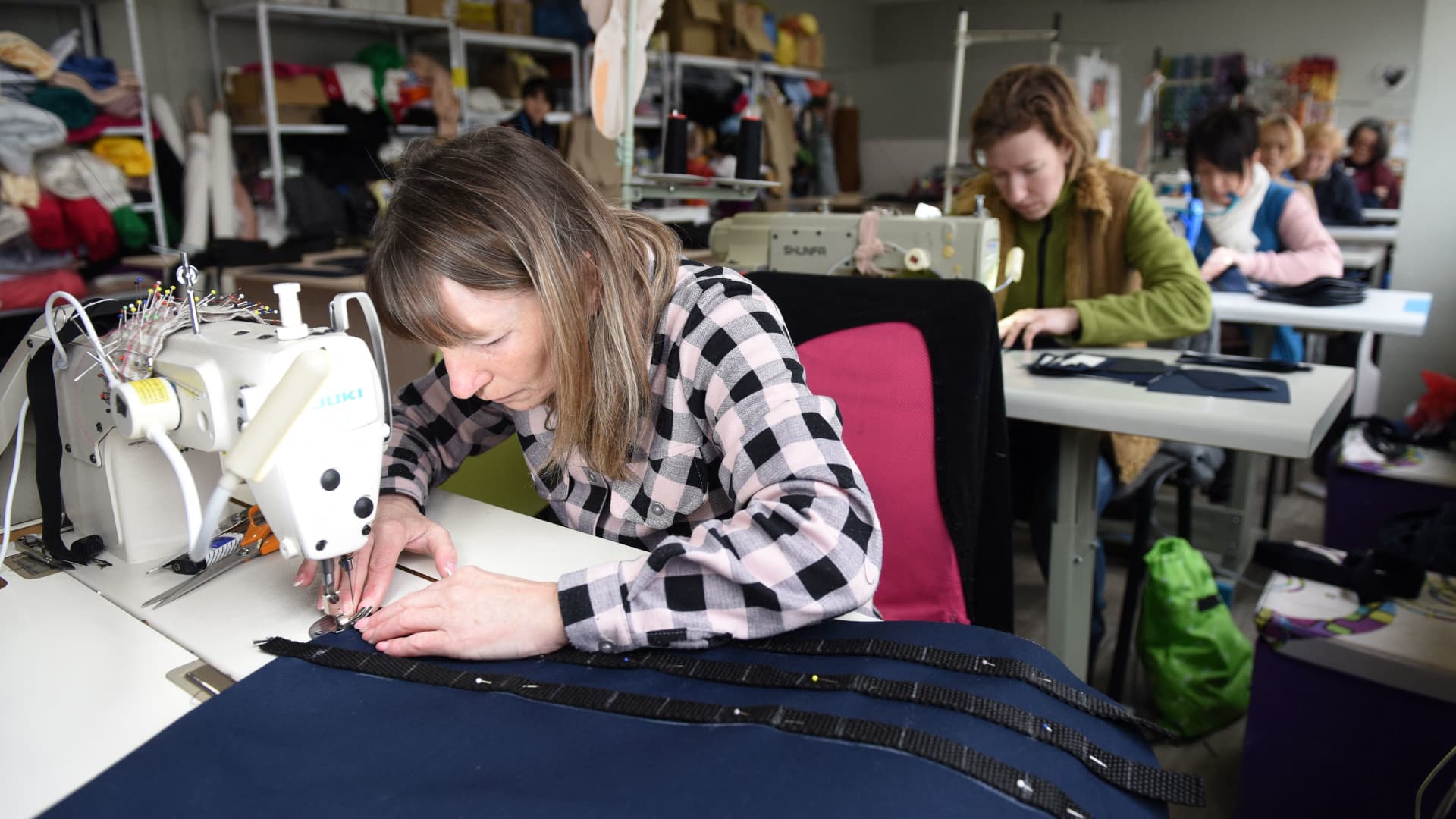 Volunteers sew tactical military vests for the Ukrainian army in the western Ukrainian city of Lviv on March 4, 2022.