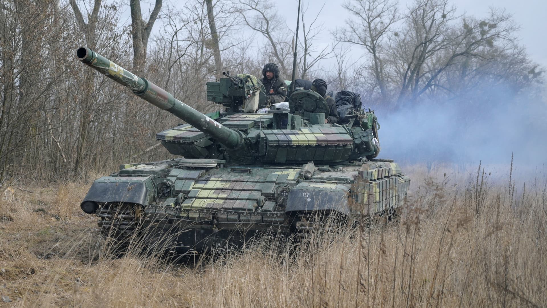 Service members of the Ukrainian armed forces are seen atop of a tank at their positions outside the settlement of Makariv, amid the Russian invasion of Ukraine, near Zhytomyr, Ukraine March 4, 2022.