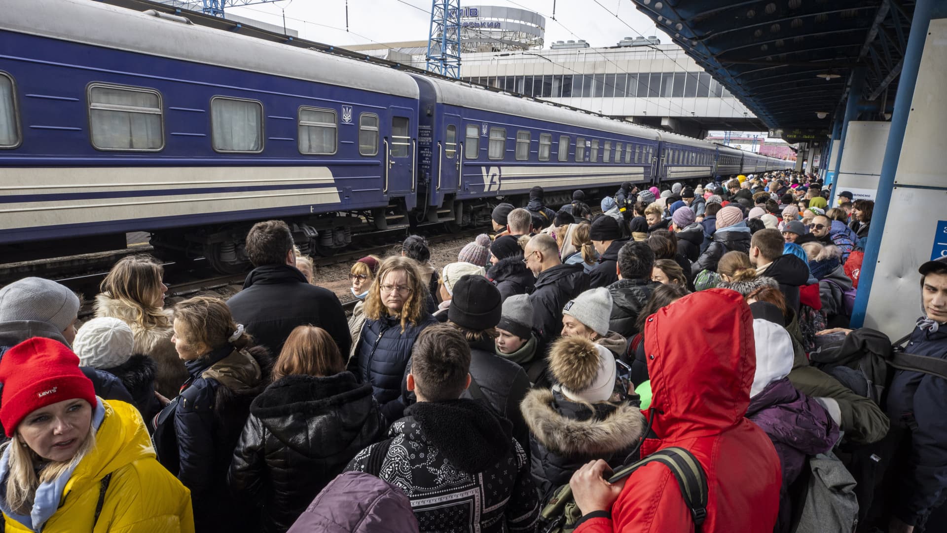 People who wanted to leave Ukraine's capital Kyiv, due to the Russian attacks on Ukraine, are seen at the Kyiv Train Station trying to find a train, in Kyiv, Ukraine on March 4, 2022.