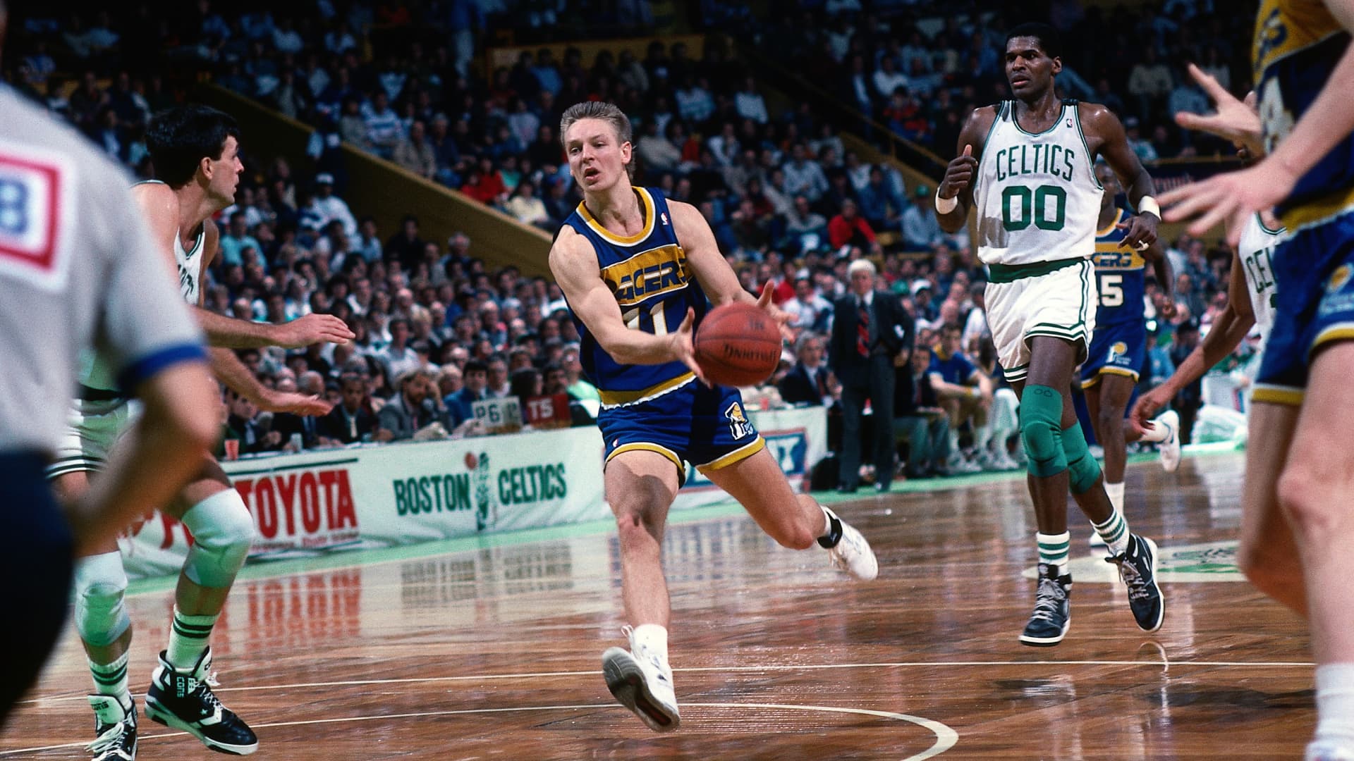 Detlef Schrempf #11 of the Indiana Pacers drives up court against the Boston Celtics during a game played in 1989 at the Boston Garden in Boston, Massachusetts.