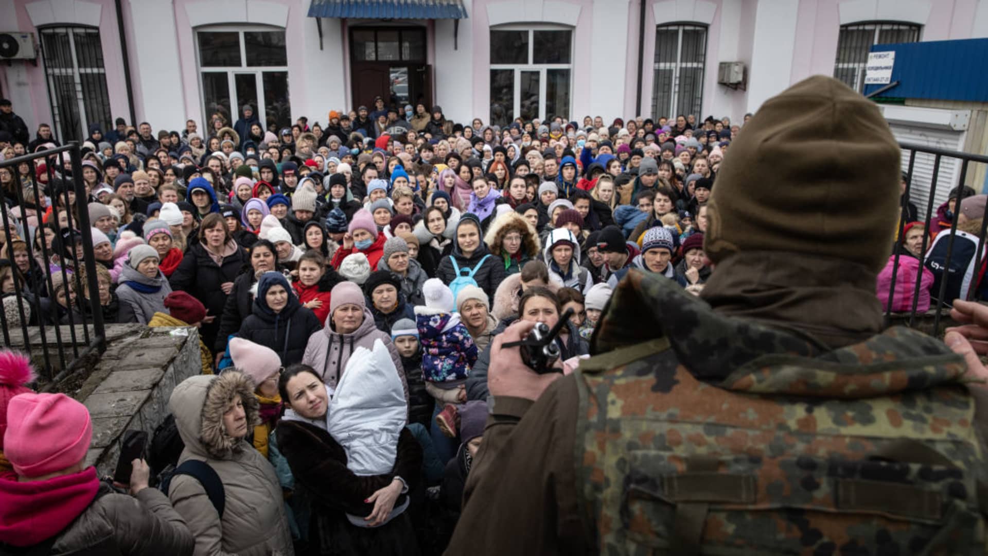 A member of the Ukrainian military gives instructions to women and children that fled fighting in Bucha and Irpin before boarding an evacuation train from Irpin City to Kyiv that was scheduled after heavy fighting overnight forced many to leave their homes on March 04, 2022 in Irpin, Ukraine.