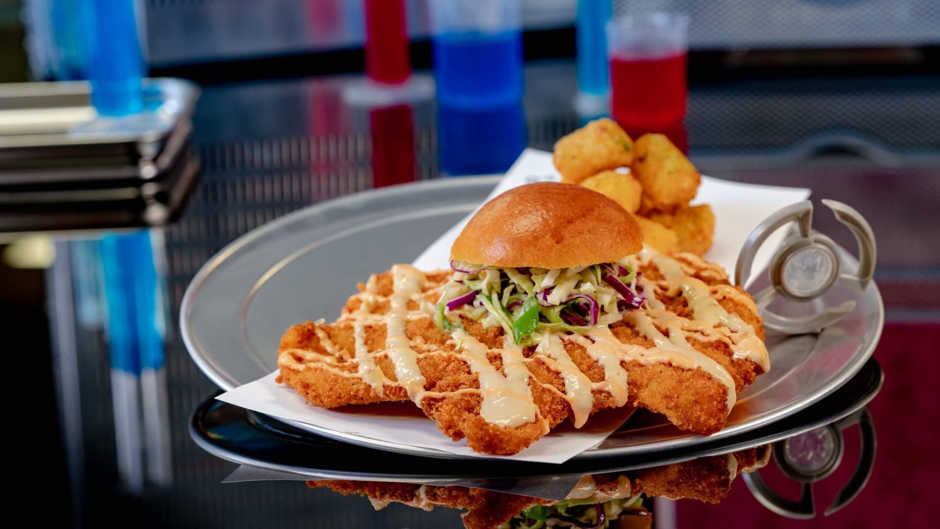 At Pym Test Kitchen in Avengers Campus inside Disney California Adventure Park, Ant-Man and The Wasp use shrinking and growing technology to innovative food. Pictured: The Not So Little Chicken Sandwich.