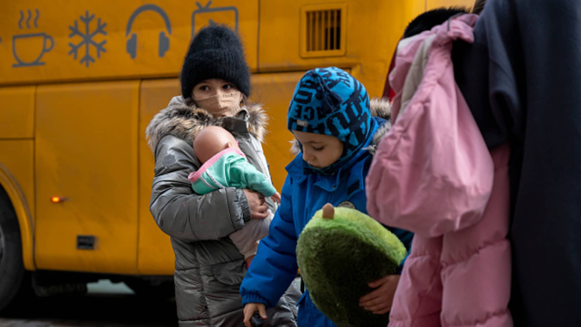 Children stand in front of a bus after their arrival. Two buses with children from an orphanage in Odessahave arrived in Berlin.