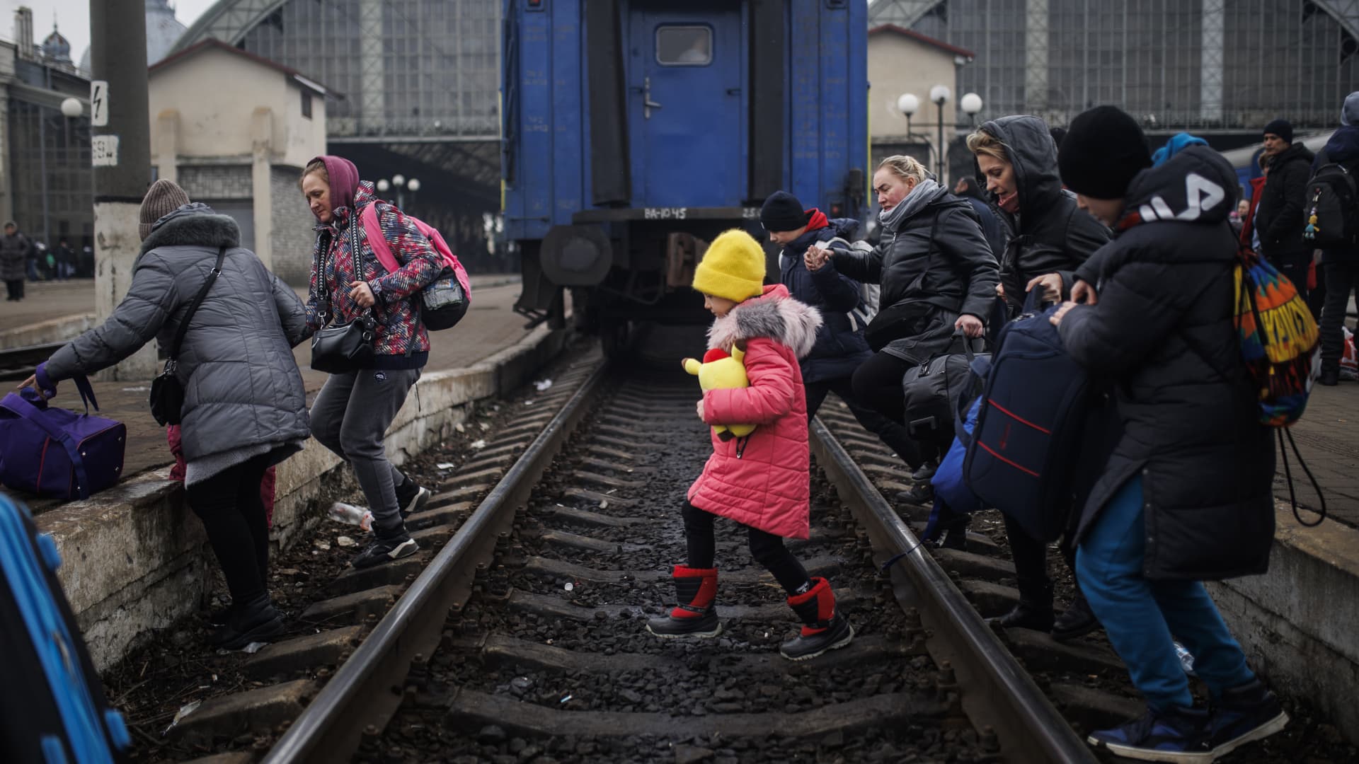 Civilians seeking to leave the city arrive at a train station in the Ukrainian city of Lviv on March 4, 2022, amid Russian attacks..