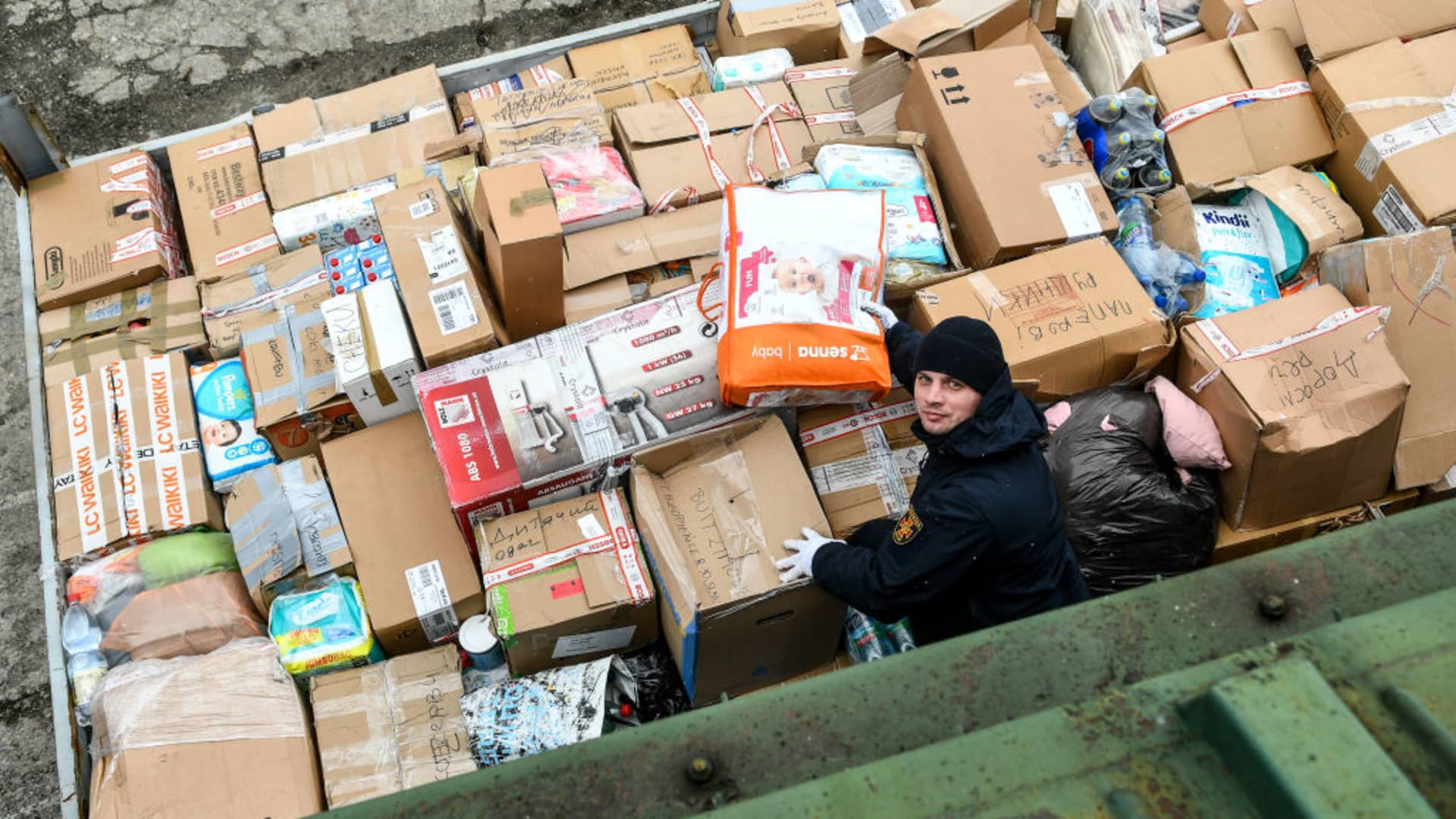 Volunteers and team members carry humanitarian aid packages arrived from Lviv, in Zaporizhzhia, Ukraine amid Russian attacks on March 5, 2022.
