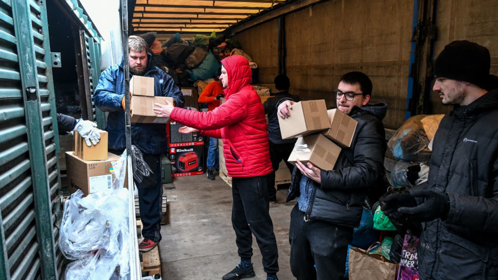 Volunteers and team members carry humanitarian aid packages arrived from Lviv, in Zaporizhzhia, Ukraine amid Russian attacks on March 5, 2022.
