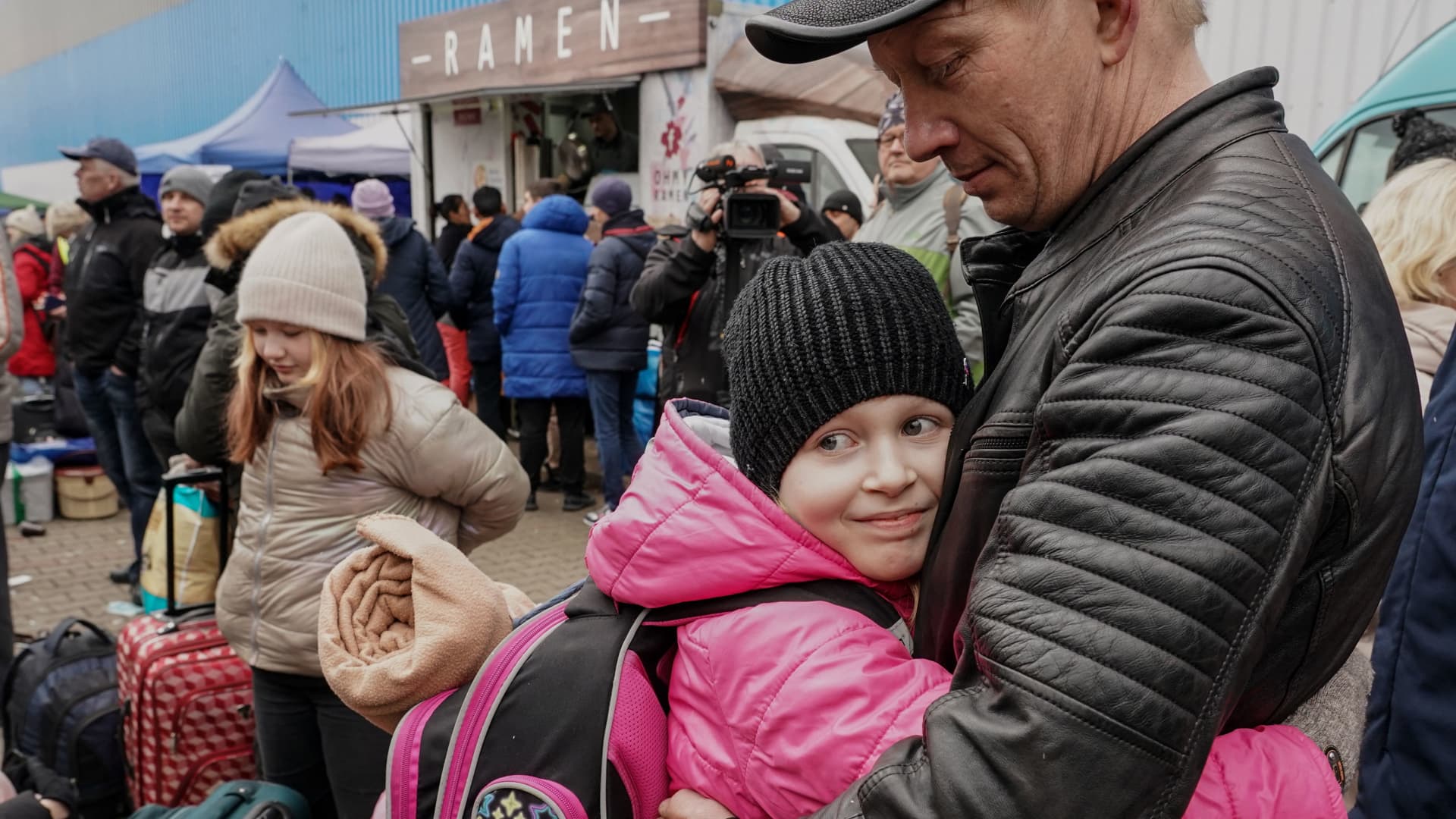 A girl, refugee from Ukraine hugs his father as they meet at the refugee distribution centre in Korczowa, Poland, on March 5, 2022.