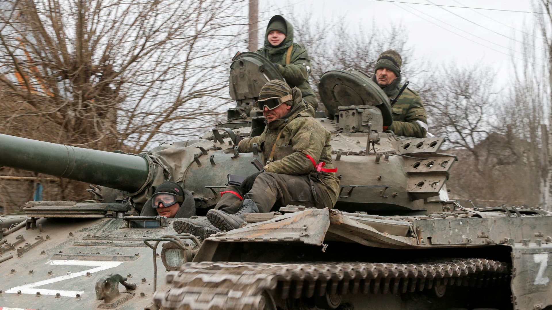 Service members of pro-Russian troops in uniforms without insignia are seen in a truck in the separatist-controlled settlement of Rybinskoye during Ukraine-Russia conflict in the Donetsk region, Ukraine March 5, 2022. 