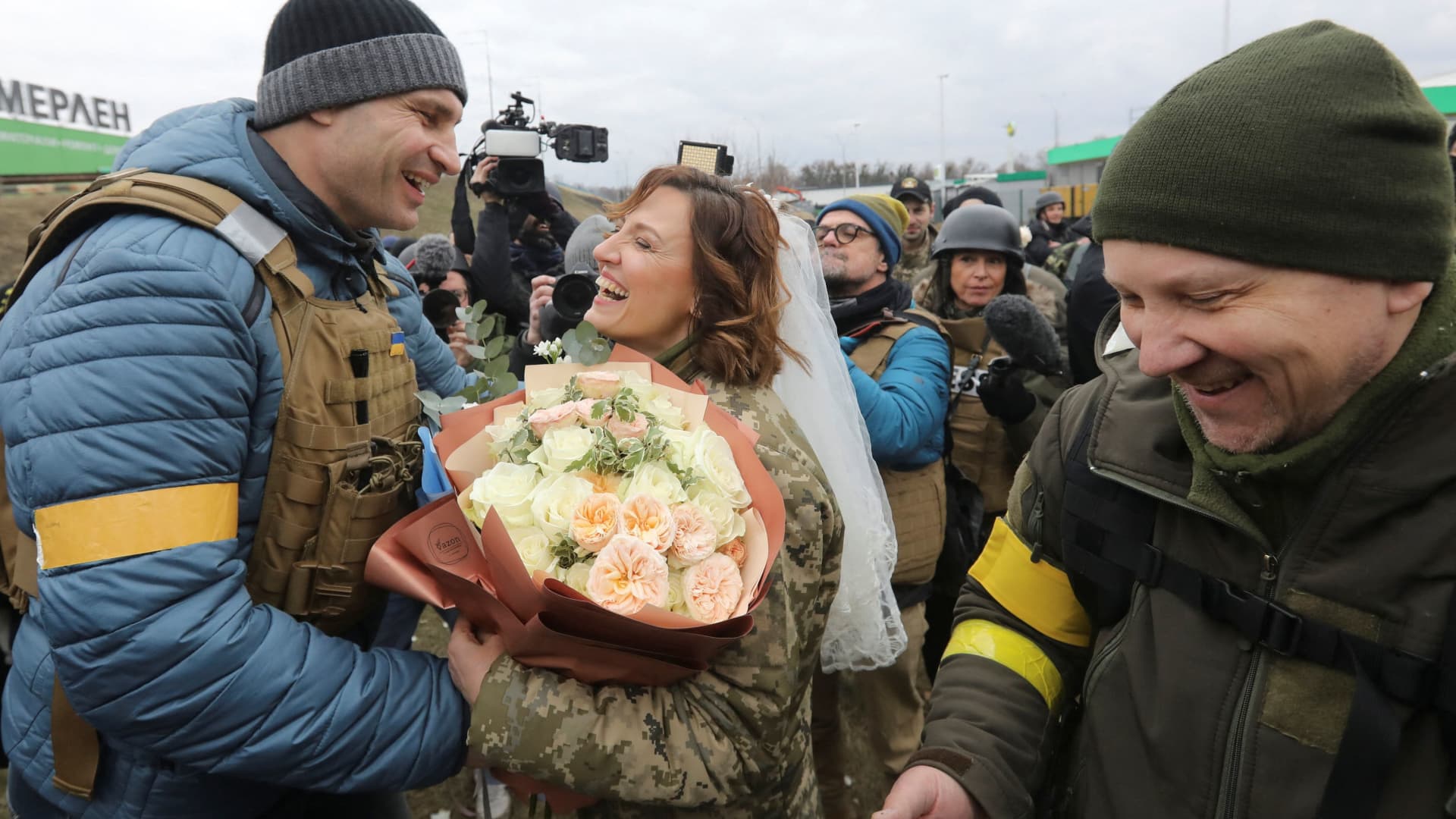 Mayor of Kyiv Vitali Klitschko congratulates members of the Ukrainian Territorial Defence Forces Lesia Ivashchenko and Valerii Fylymonov at their wedding during Ukraine-Russia conflict, at a checkpoint in Kyiv, Ukraine March 6, 2022.