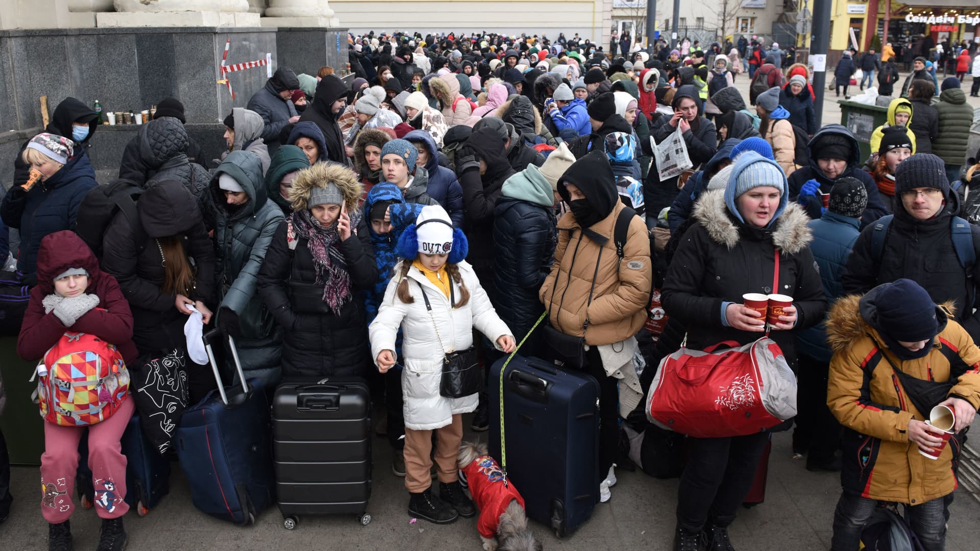 People wait for a train to Poland at the railway station of the western Ukrainian city of Lviv on March 6, 2022, 11 days after Russia launched a military invasion on Ukraine.