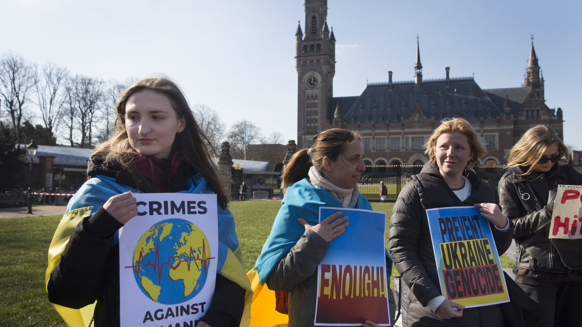 Ukrainian nationals stand outside the International Criminal Court of Justiceor Peace Palace on the first day of hearings on March 7, 2022 in The Hague The Netherlands.