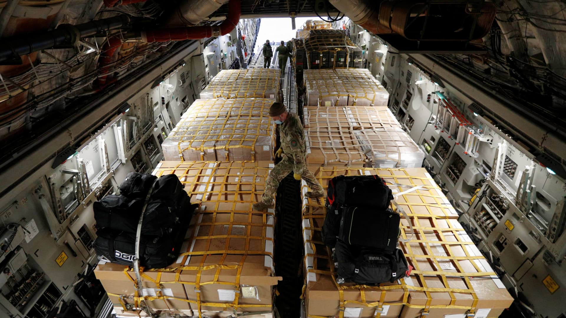 Canadian Forces personnel load lethal and non-lethal aid to be sent to Ukraine, on a transport aircraft bound for Poland, following Russia's invasion of Ukraine, at CFB Trenton in Trenton, Ontario, Canada, March 7, 2022.