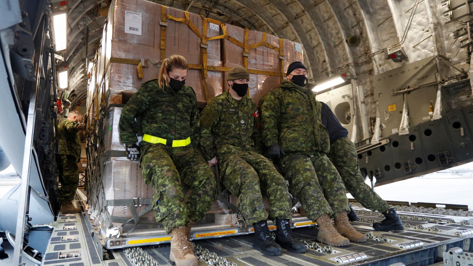 Canadian Forces personnel load lethal and non-lethal aid to be sent to Ukraine, on a transport aircraft bound for Poland, following Russia's invasion of Ukraine, at CFB Trenton in Trenton, Ontario, Canada, March 7, 2022.