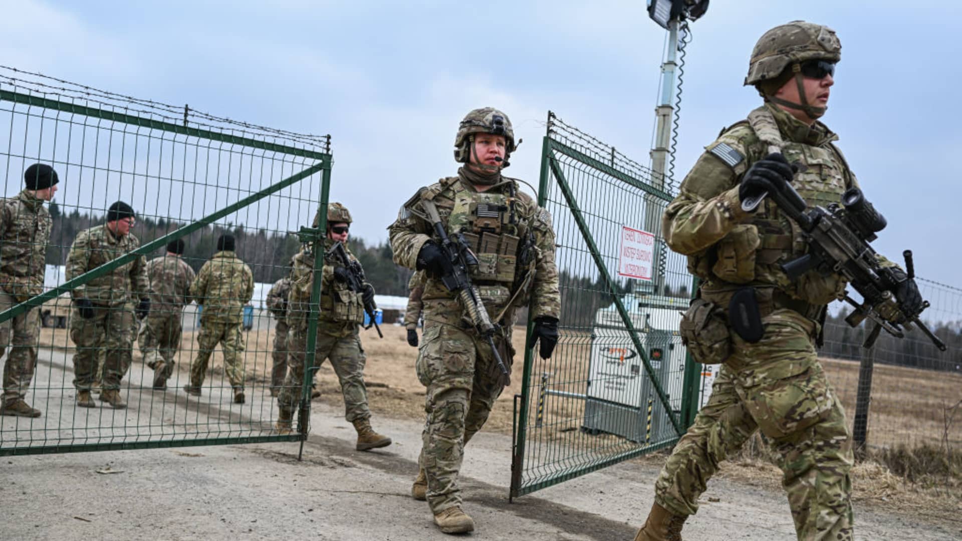 U.S. Army soldiers assigned to the 82nd Airborne carry military equipment as they take part in a exercise outside the operating base at the Arlamow Airport on , 2022 in Wola Korzeniecka, Poland.