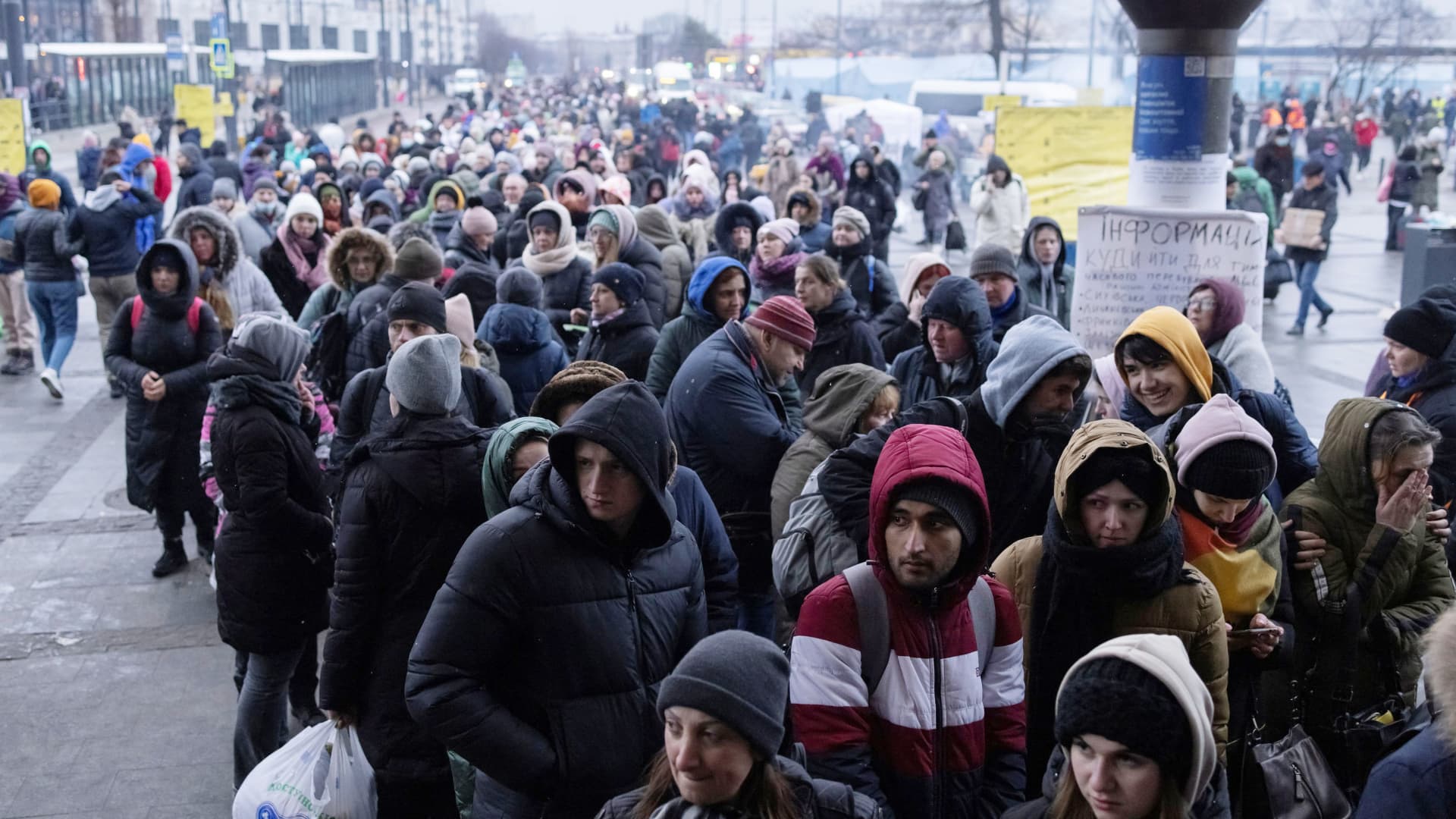 Refugees queue for trains to Poland following the Russian invasion of Ukraine, at the train station in Lviv, Ukraine, March 7, 2022.