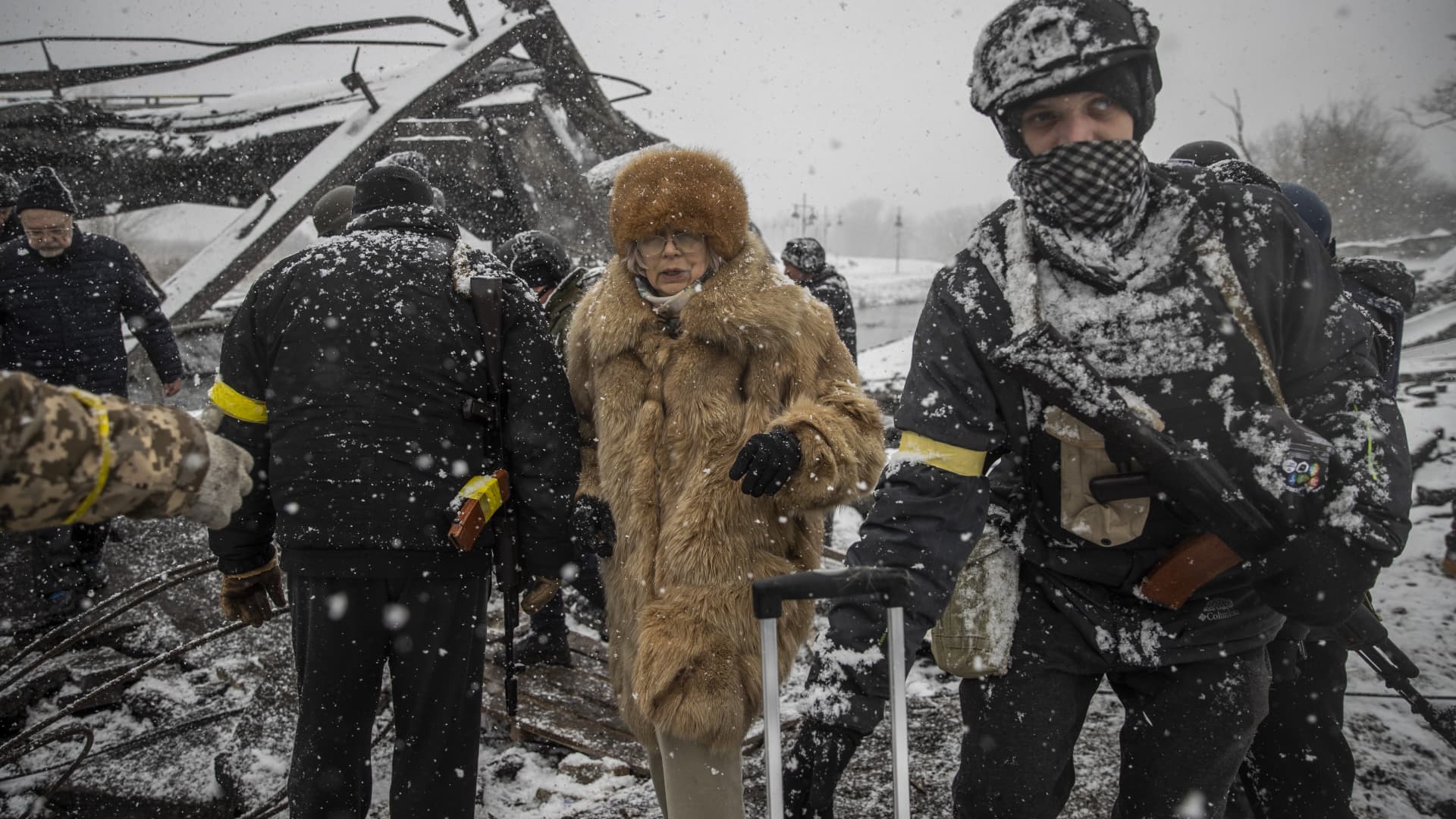 Civilians continue to flee from Irpin due to ongoing Russian attacks as snow falls in Irpin, Ukraine on March 08, 2022.