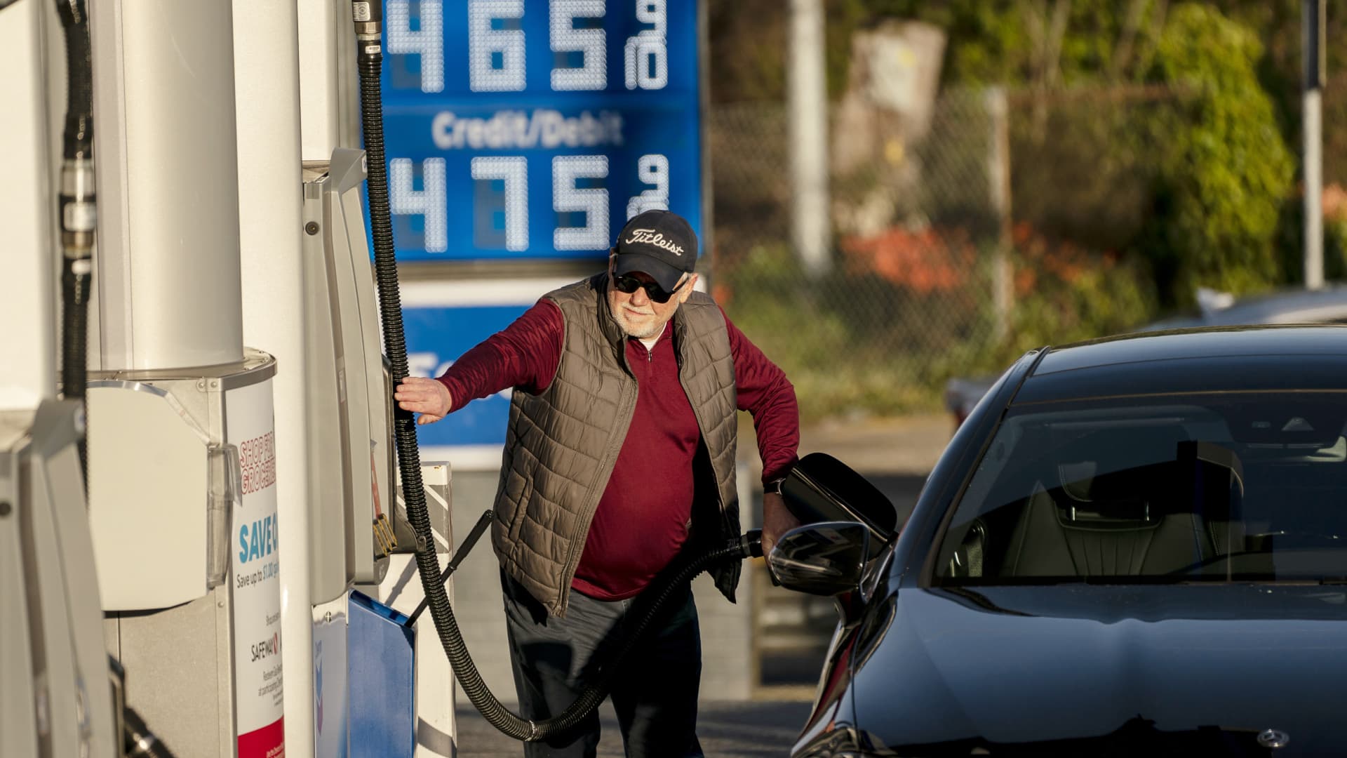 A customer refuels at a Chevron gas station with prices above $4 a gallon in Seattle, Washington, U.S., on Monday, March 7, 2022.