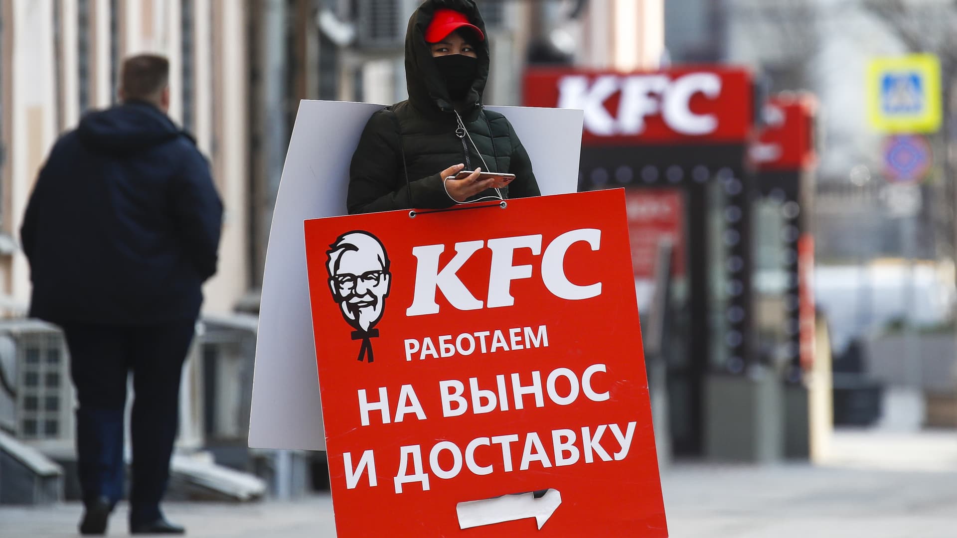 A sign walker outside a KFC fast food restaurant; the Russian government has extended the period off work with full pay until April 30 nationwide to counter the spread of the COVID-19 infection.