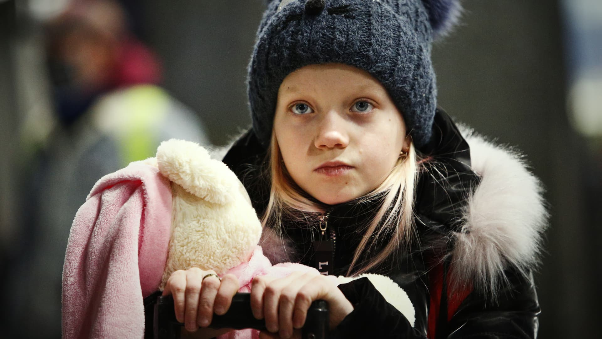 A young girl is seen waiting with her luggage at the Warsaw East railway station in Warsaw, Poland on March, 8, 2022.